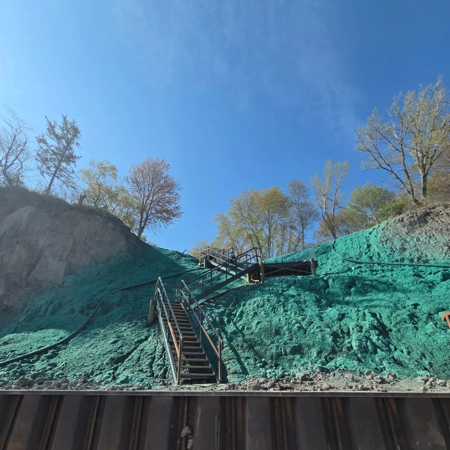 Today was steep slope Saturday in Port Alma. We hydroseeded this slope with crown vetch and oats as a nurse crop for @gordonsshorelinemarine to finish up there seawall, stair and grading project. #hydroseeding #flexterra #steepslope #erosioncontrol