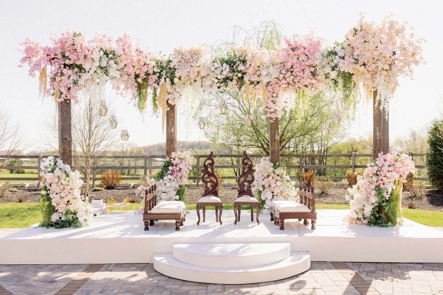 Pink pastel florals strung along wooden beams at the Barn at Villa Venezia.