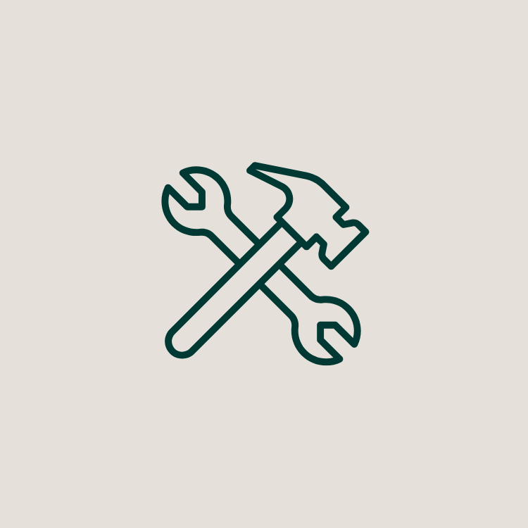 Line drawing of a wrench and a hammer crossed over each other.