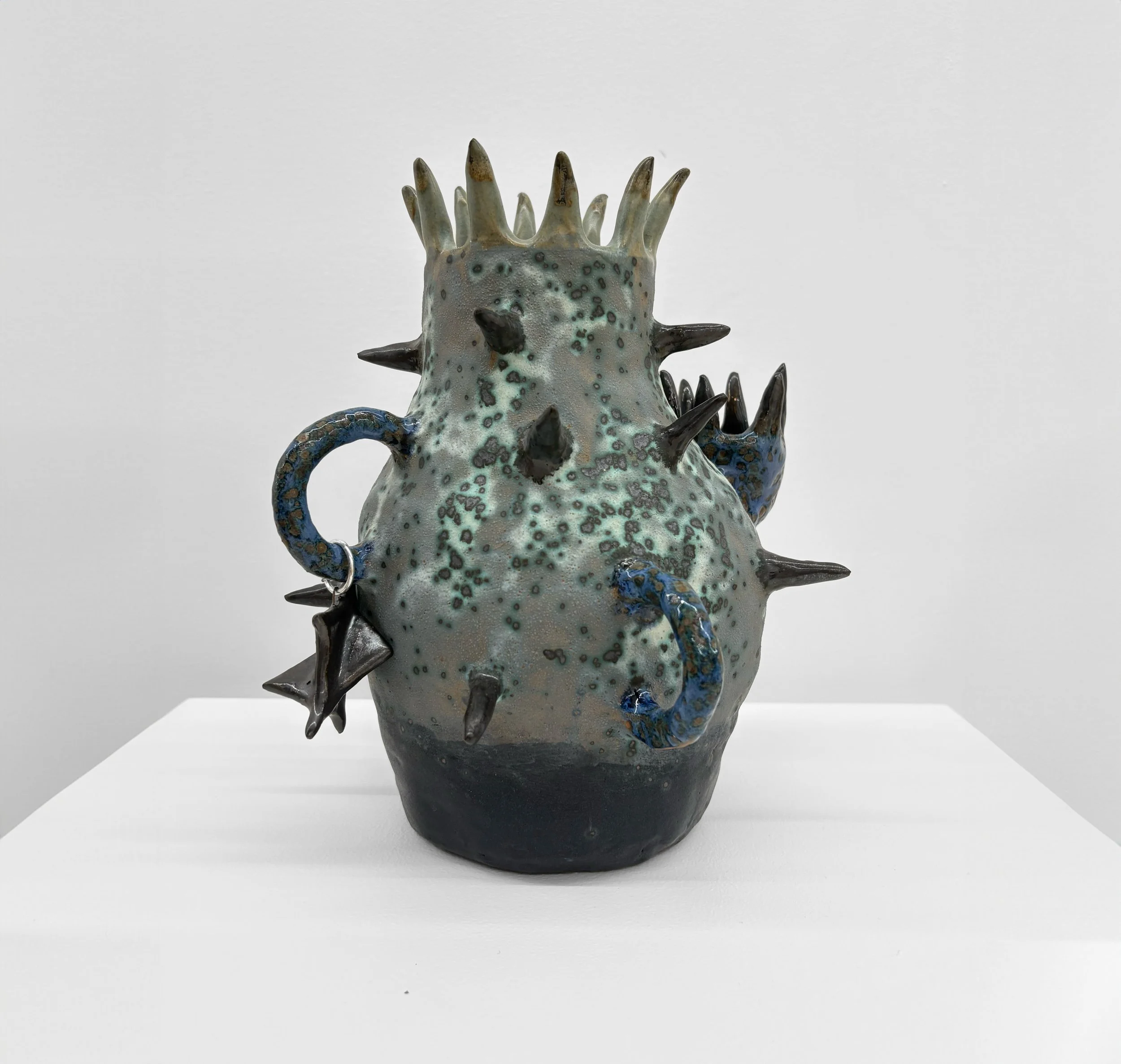  Thorns for Flowers #3 , 2025
Stoneware, glaze, metal ring
9 1/2 x 8 x 8 in | 24 x 20.5 x 20.5 cm