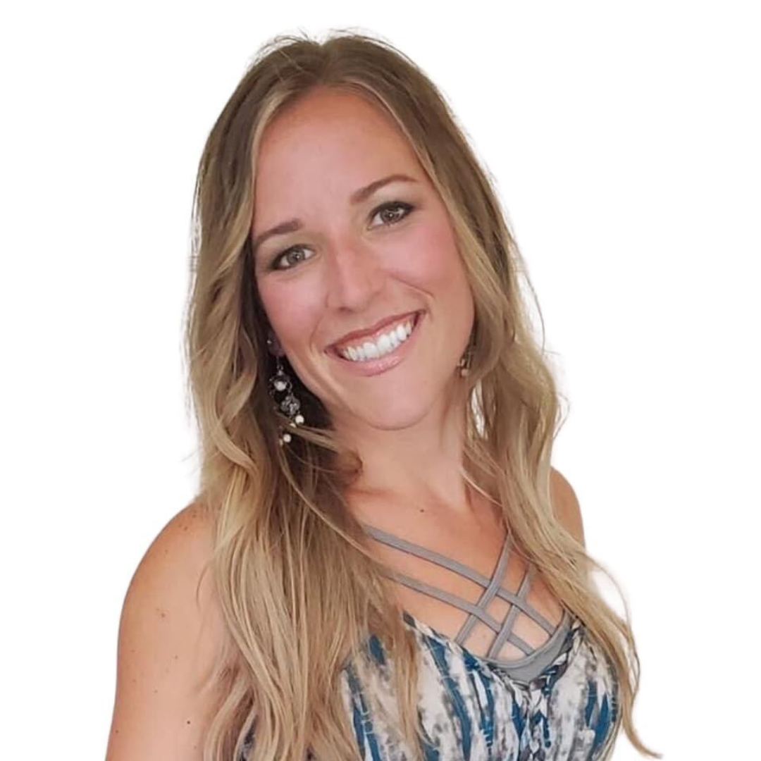 Camille Moore, Certified Health & Life Coach, smiling confidently in a casual top