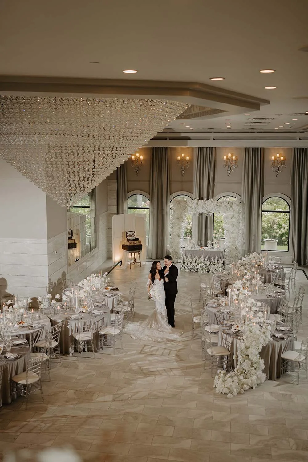 Villa Venezia in Hudson Valley Ballroom wedding with white and silver decor and sculpture floral installations
