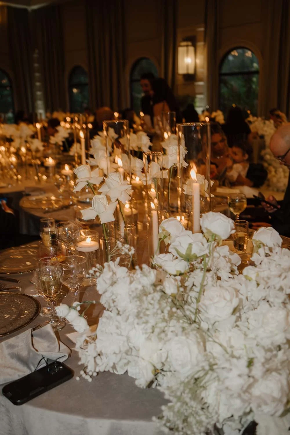 Candlelit wedding reception with monochromatic wedding