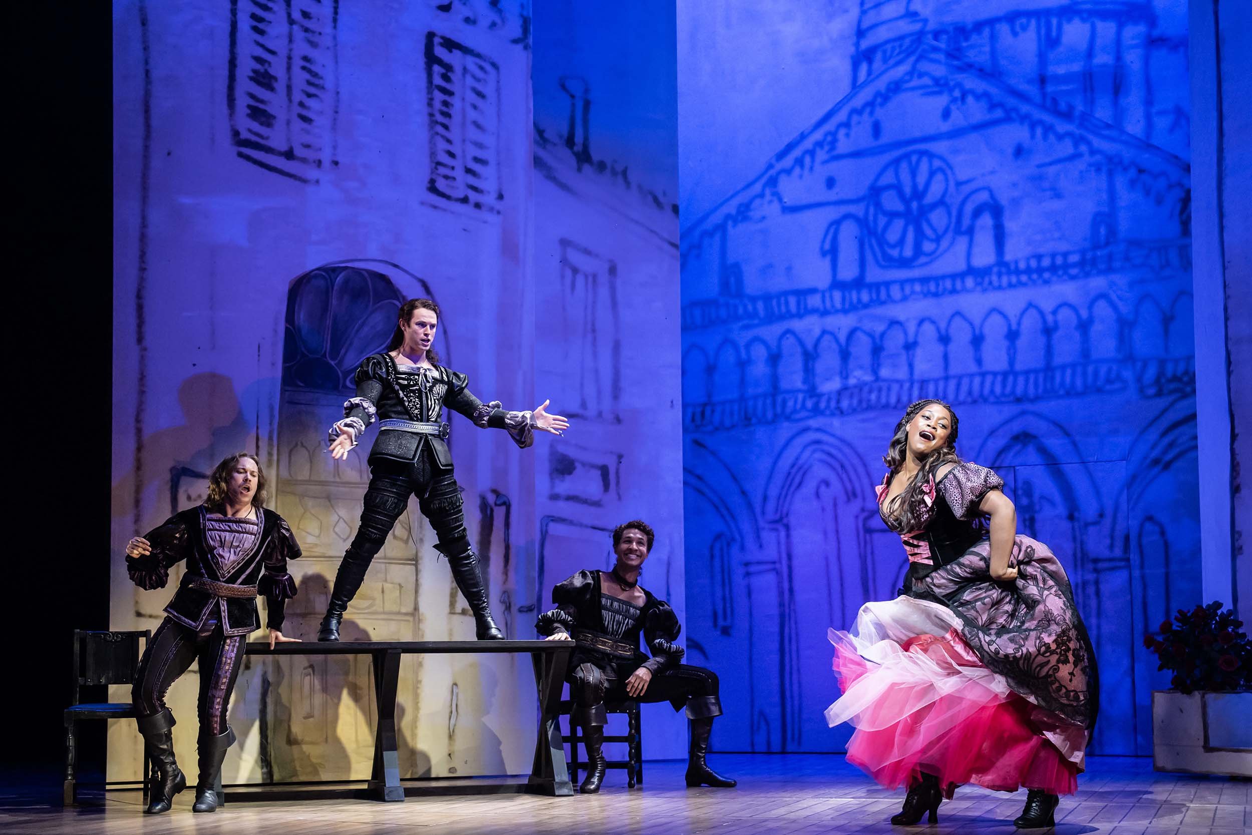 Cast of Kiss Me, Kate performing on stage at the Barbican, showcasing Act Productions’ vibrant choreography and musical theatre flair.