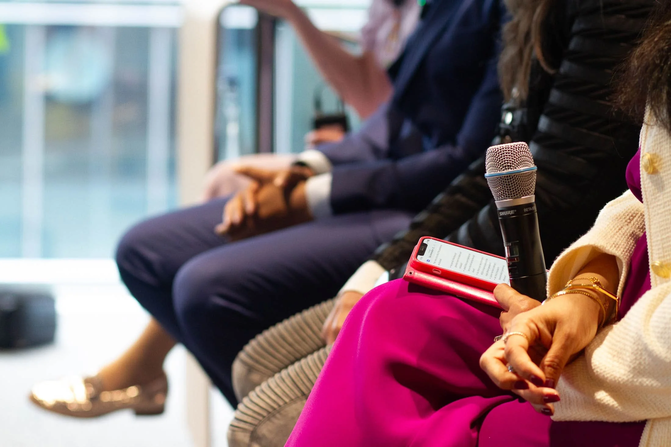 female-speaker-addressing-panel.jpg
