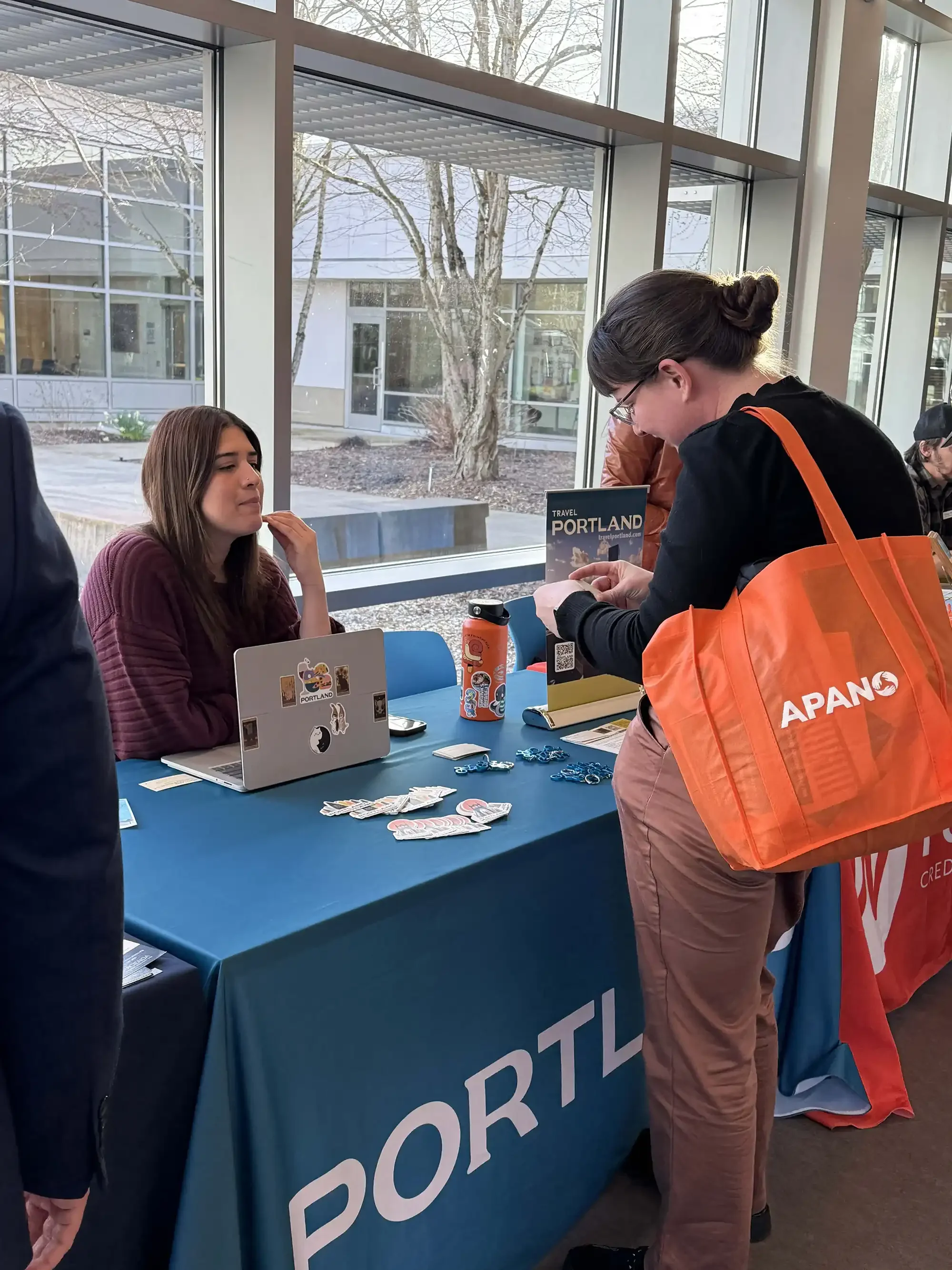 Attendee at a table at Community Resource Fair