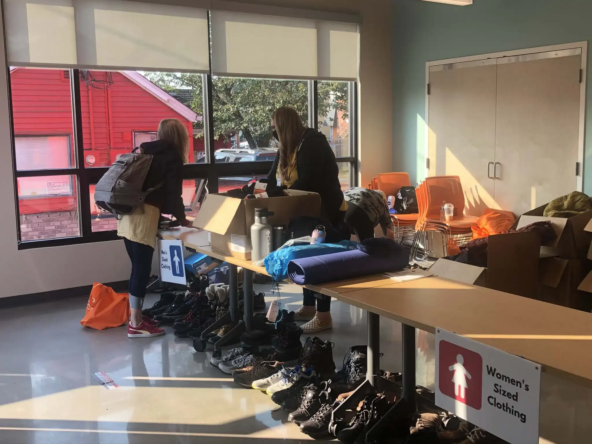 Volunteer distributing clothing