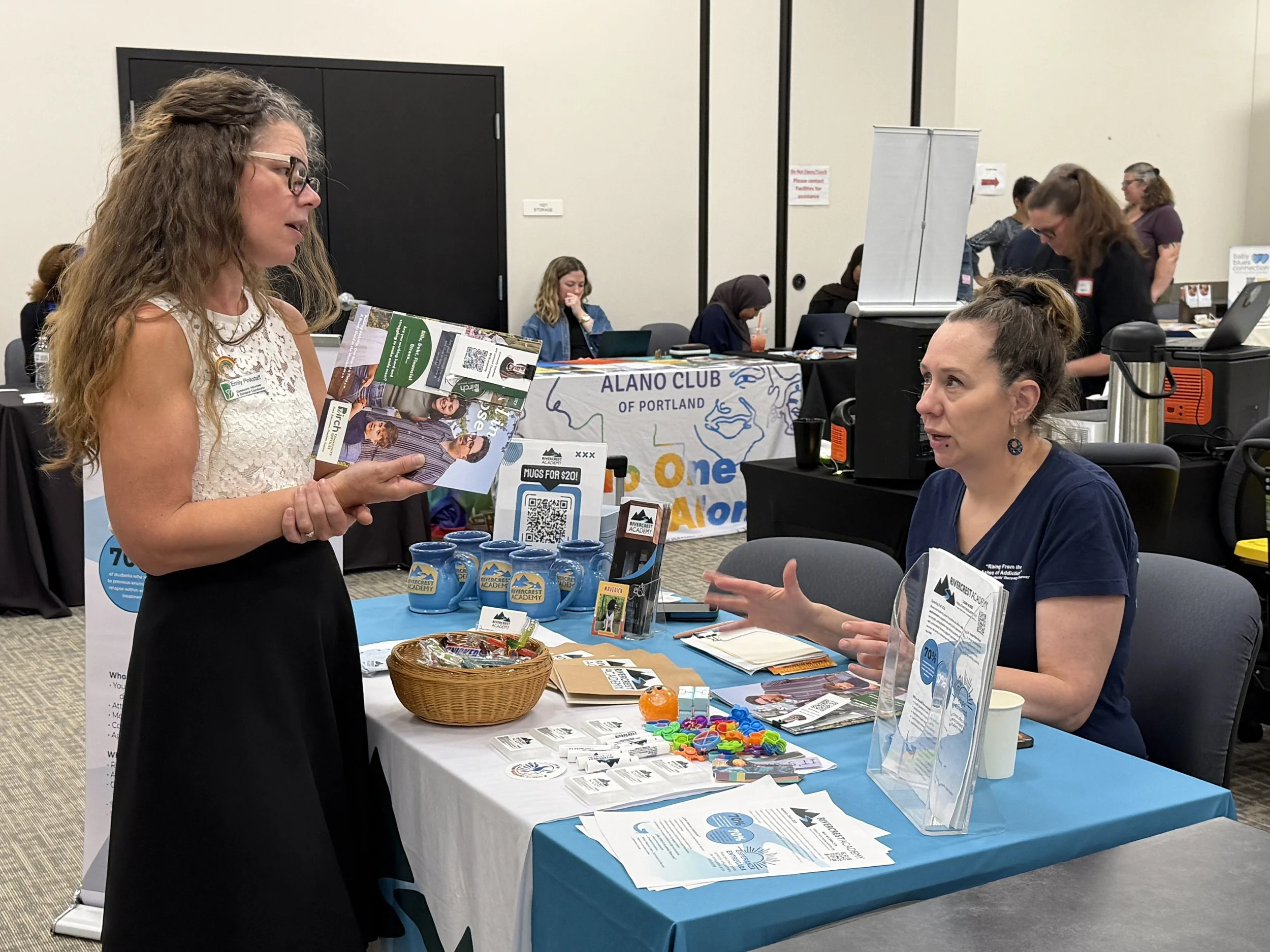 Two women talking at Community Services Network Resource Fair