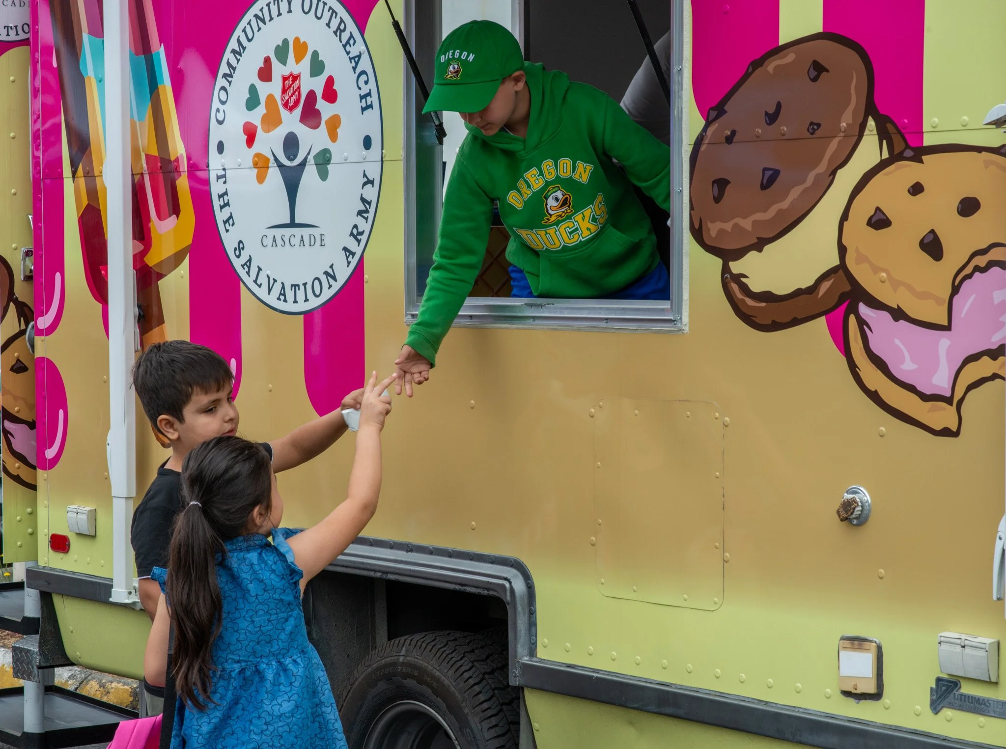 Children getting ice cream at community event
