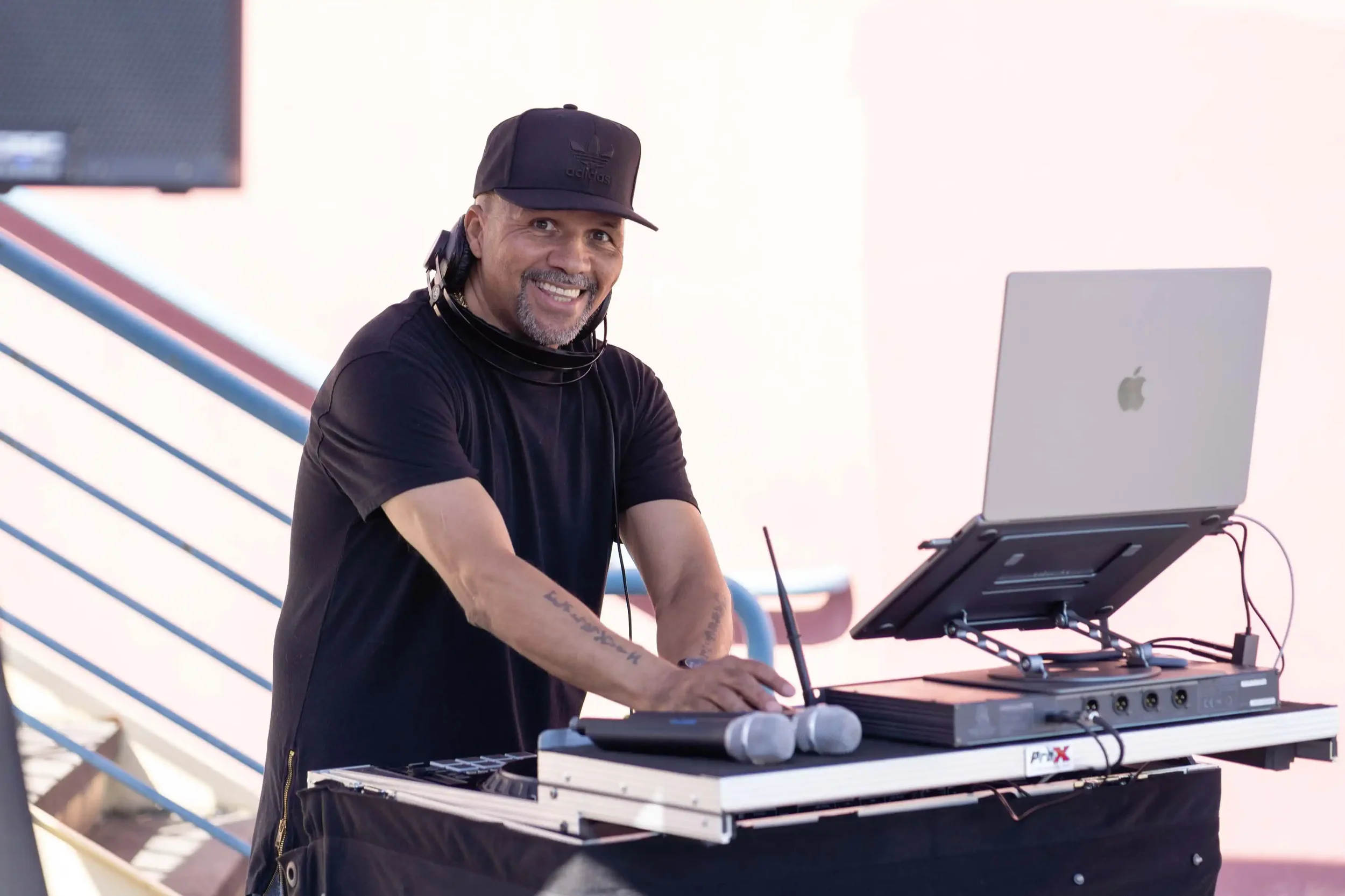 Smiling DJ playing music