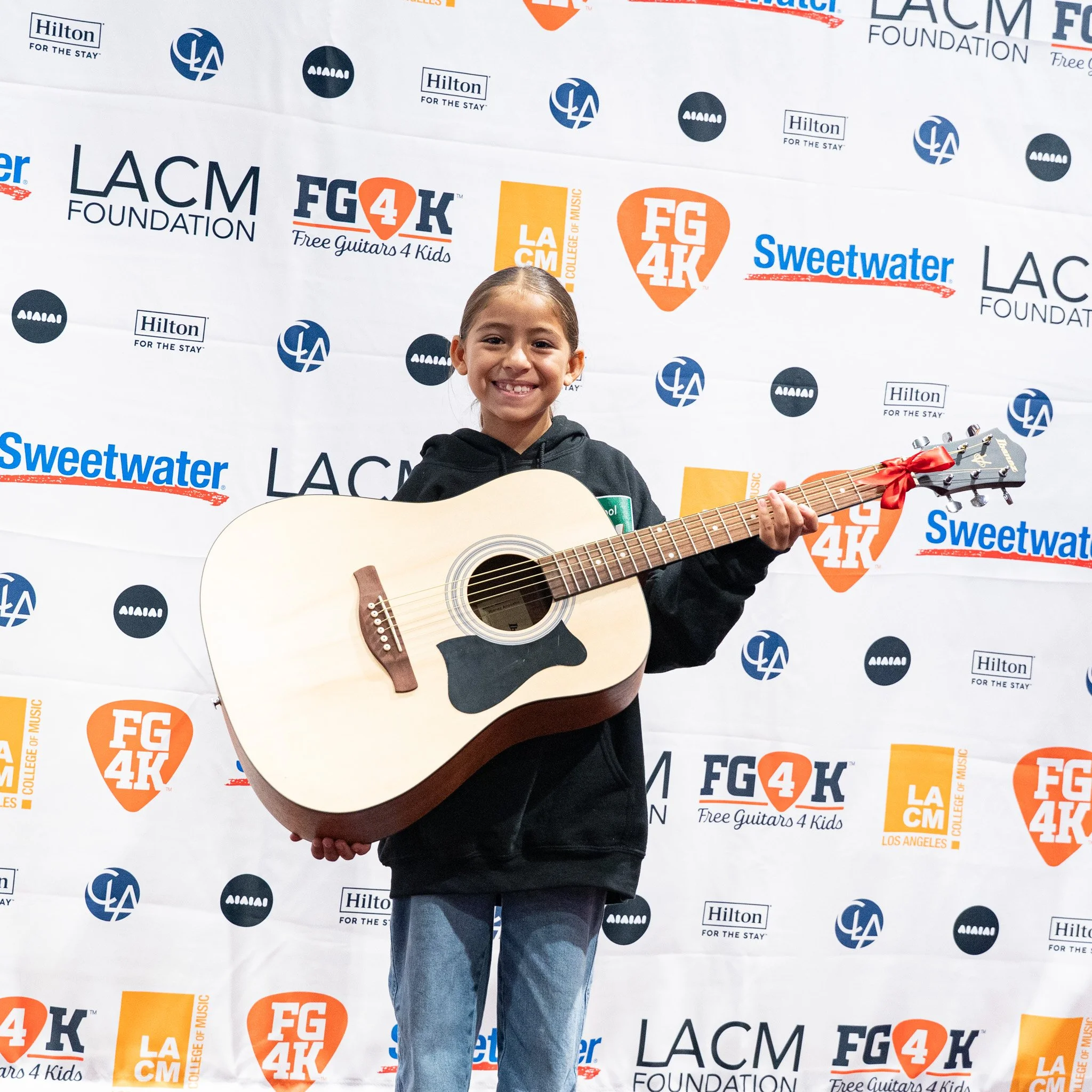 LACM guitar giveaway girl with guitar
