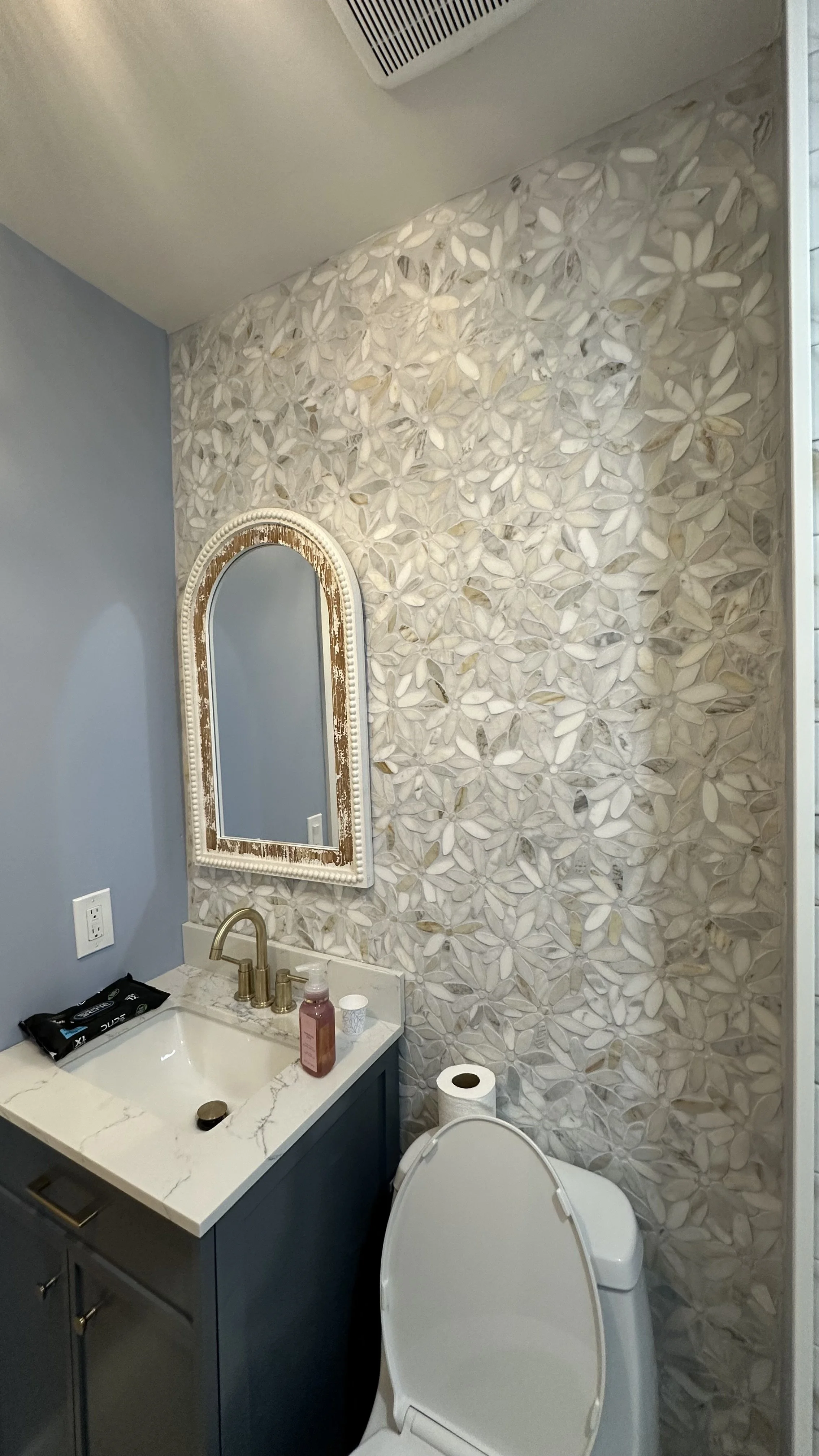 Demolition, tile flooring, wall, light fixture, shower fixtures, toilet, vanity and door installation.