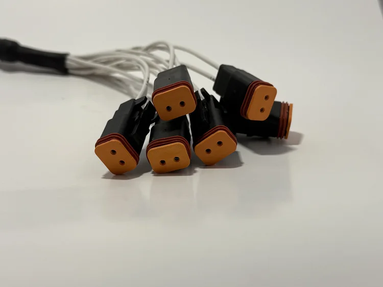 Skid Sync attachment harnesses