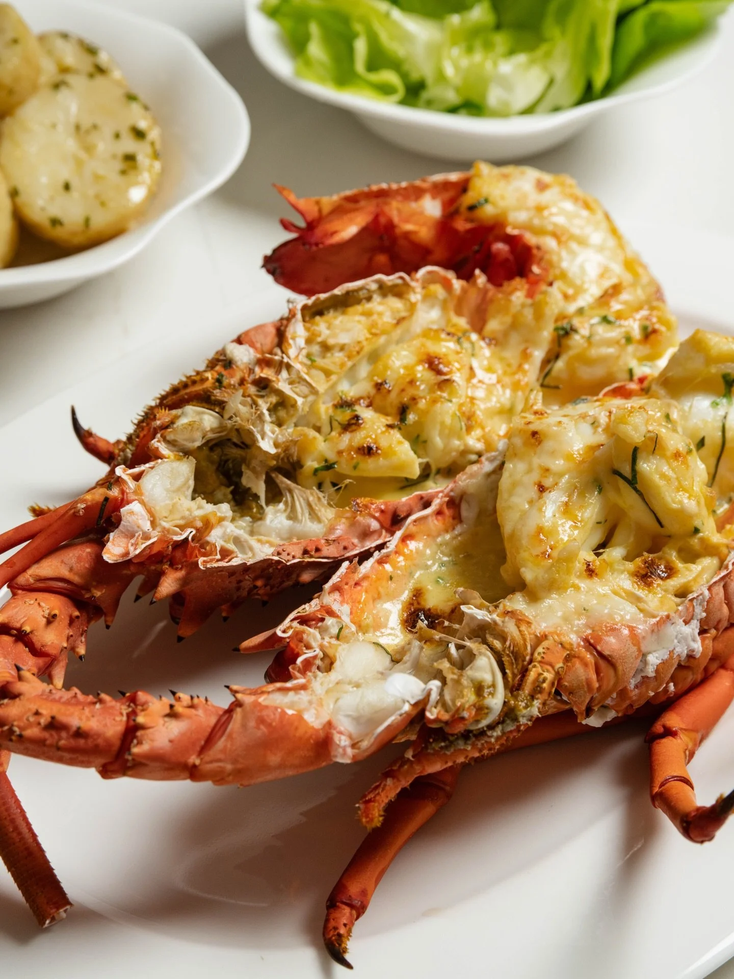 Rock Lobster Thermidor in its most classic form - served in the shell, the sauce rich with white wine, cream, mustard and Parmesan. Served with buttered new potatoes and a simple salad.⁠
⁠
#RickSteinAtCoogeeBeach #LobsterThermidor #CoogeeDining #Sydn