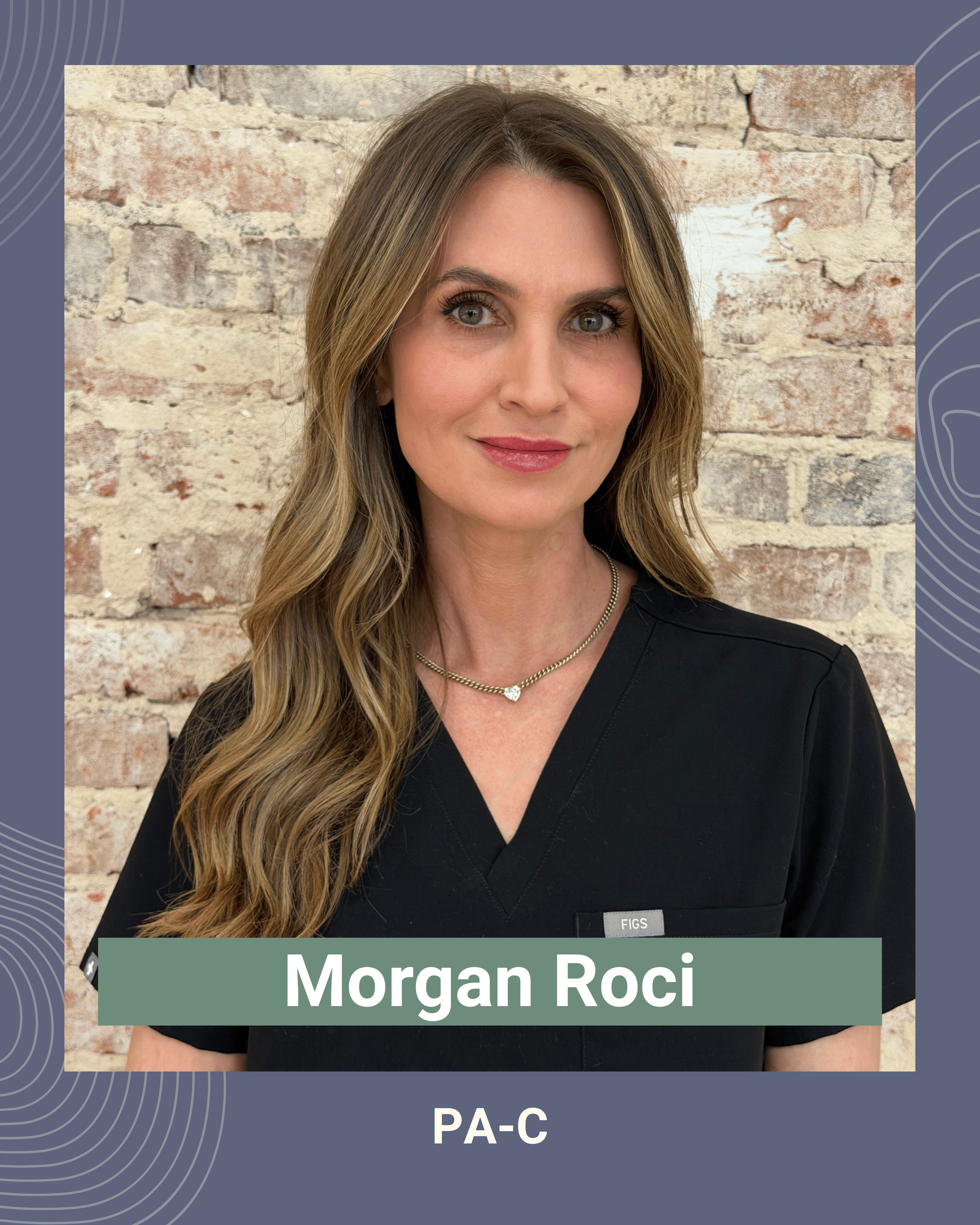 Portrait of a woman with long wavy blond hair, wearing a black medical uniform, a gold necklace, and standing against a brick wall background.