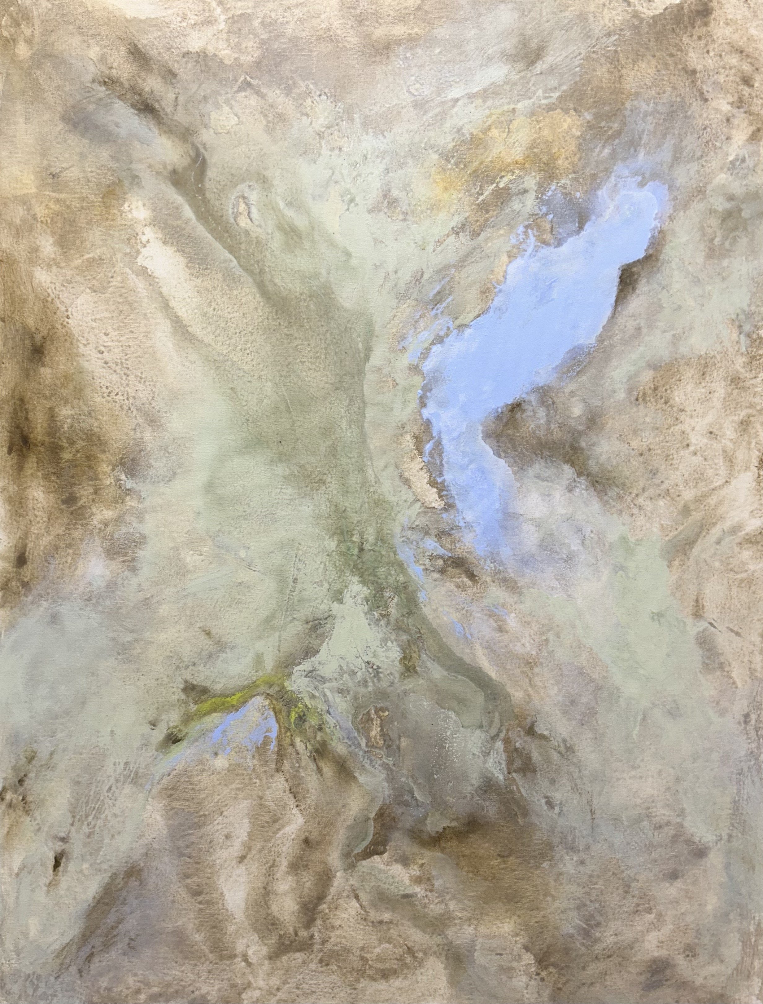 An overhead aerial view of a mountain landscape with a winding river and patches of snow.