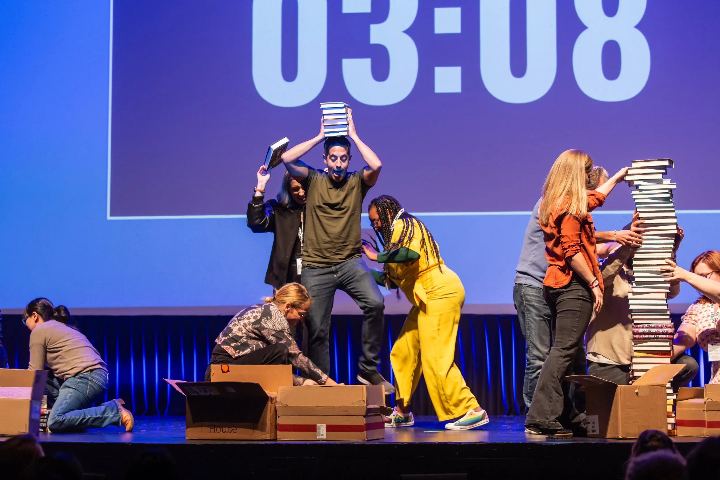 Authors try to make the highest stack of books in the Smackdown