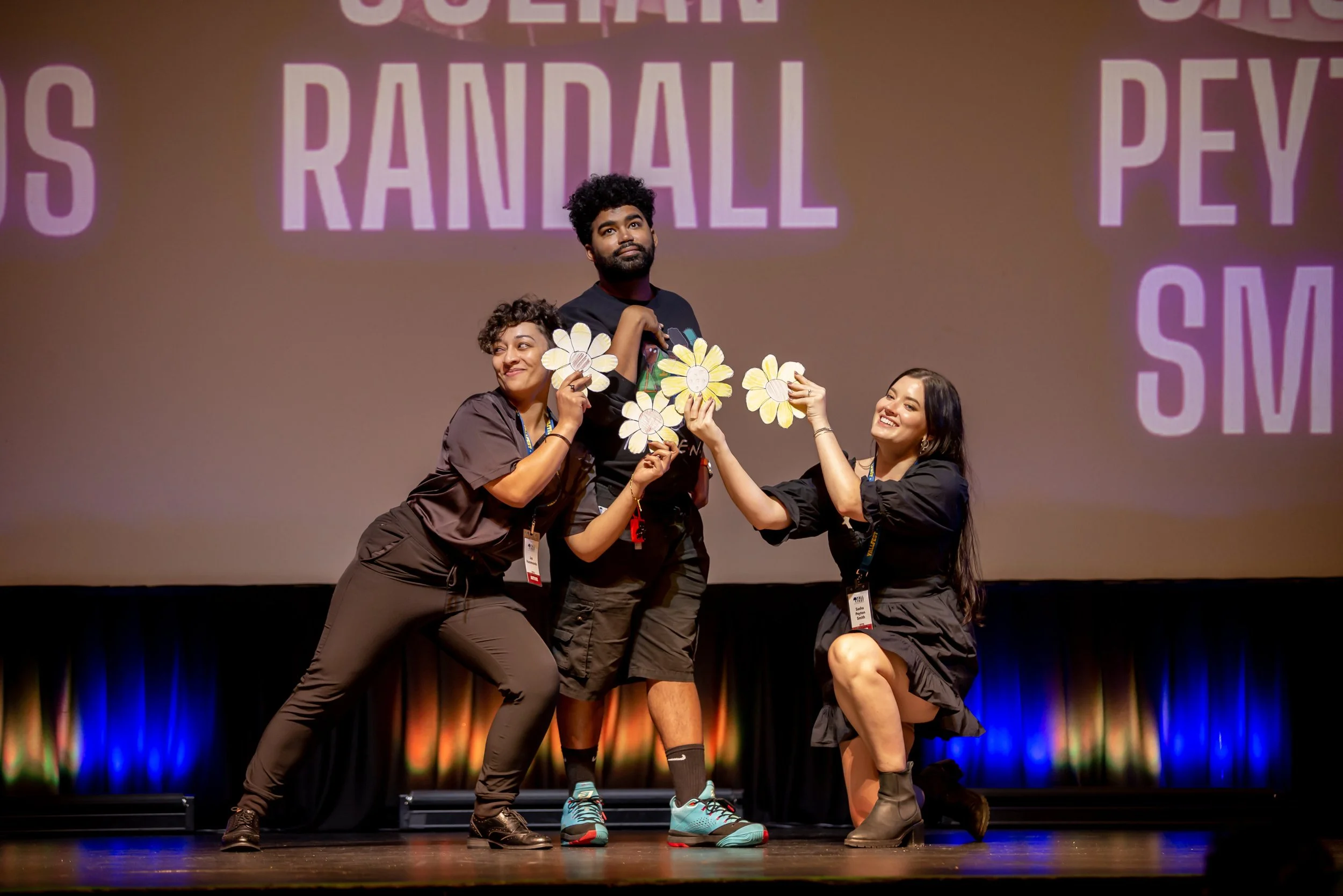 Authors Jas Hammonds, Julian Randall, and Sasha Peyton Smith recreate a cover during the smackdown