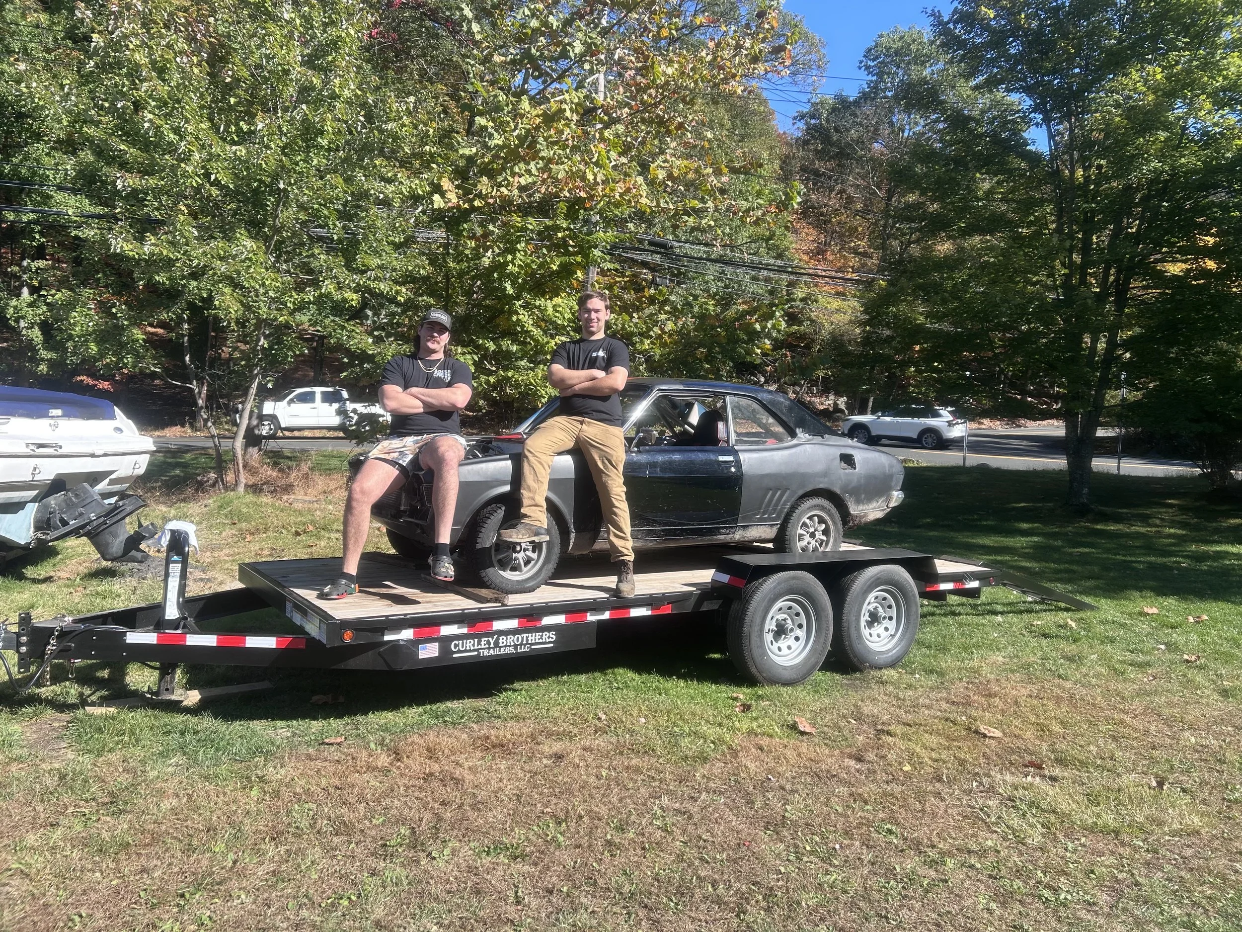 Founders of Curley Brothers Trailer LLC with there first trailer