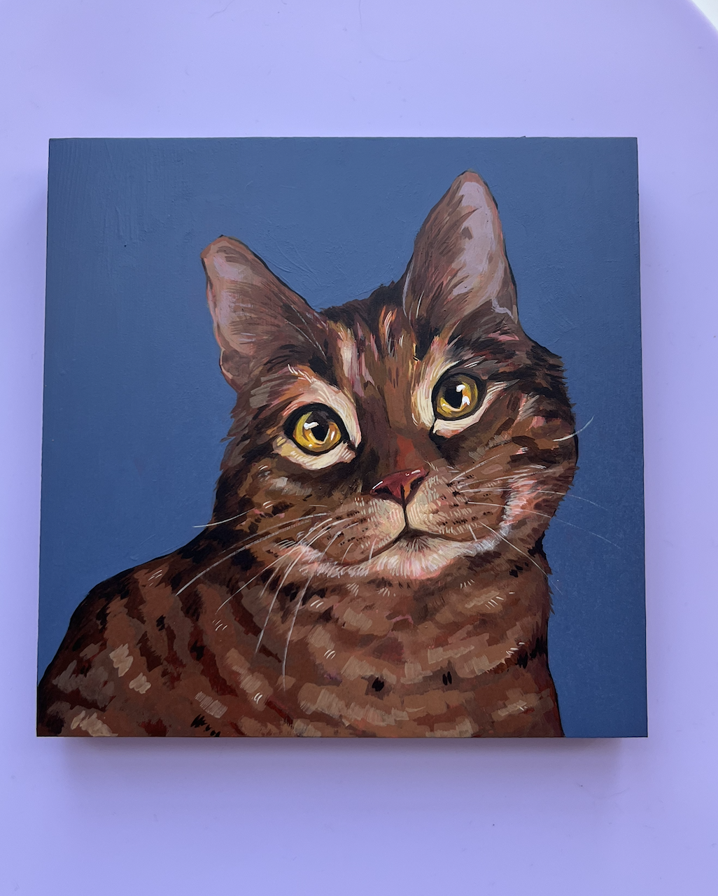 Painted portrait of a tabby cat with yellow eyes on a blue background.