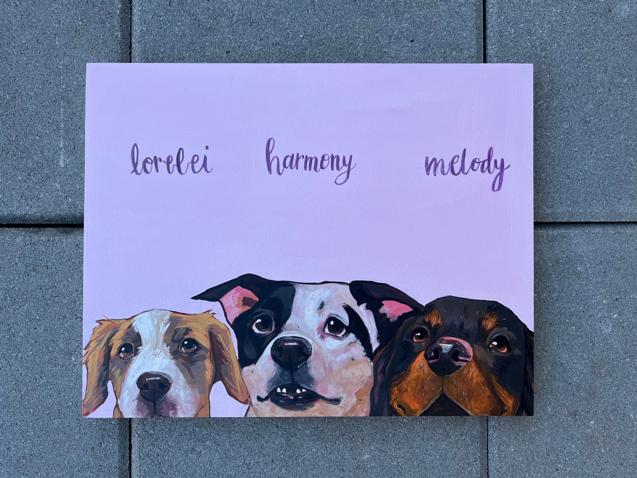 Painting of three dogs with the words 'lorelei', 'harmony', and 'melody' written above.