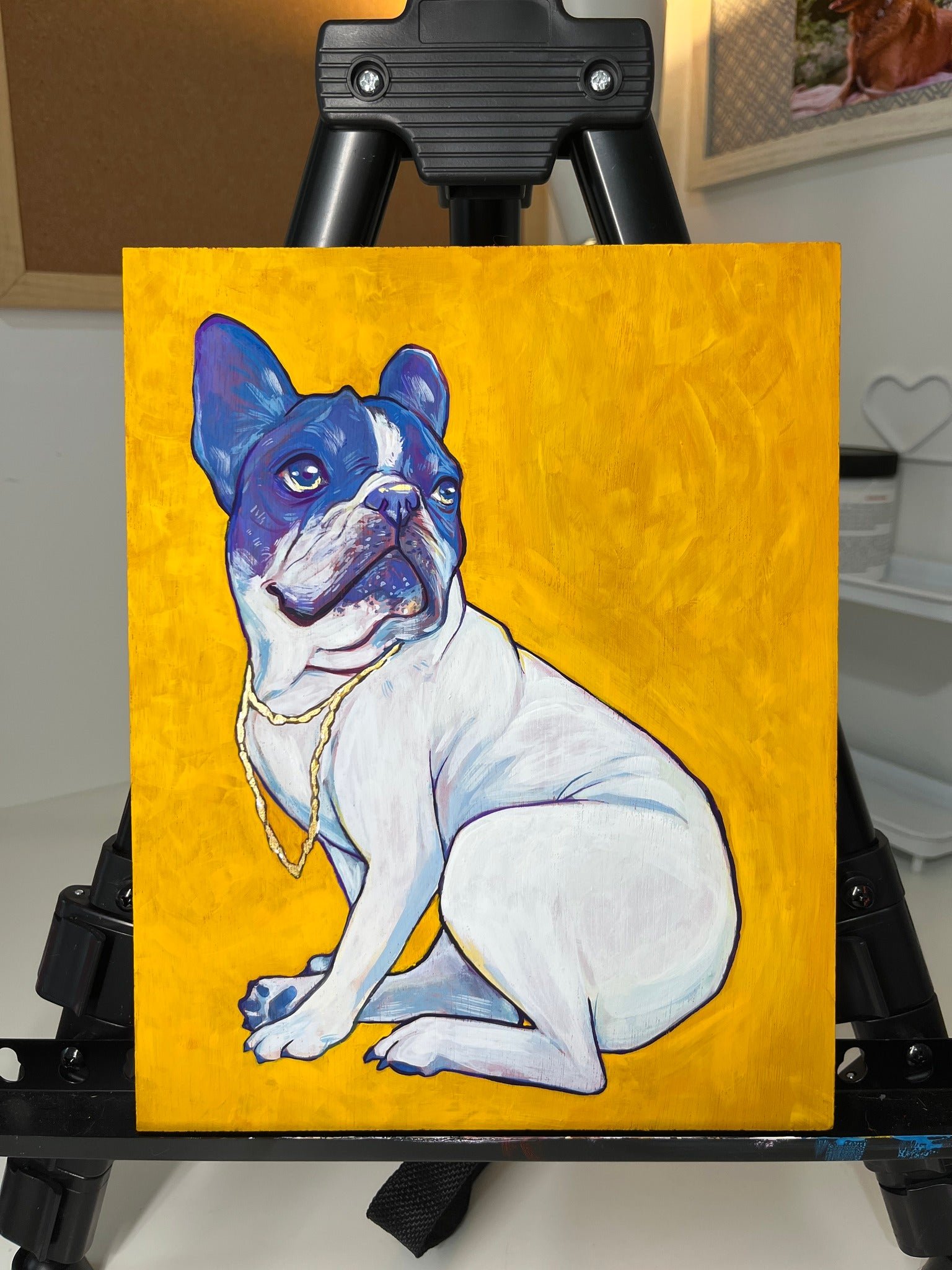 Painting of a French Bulldog with a white body and black and white face, wearing a gold chain, on a yellow background.