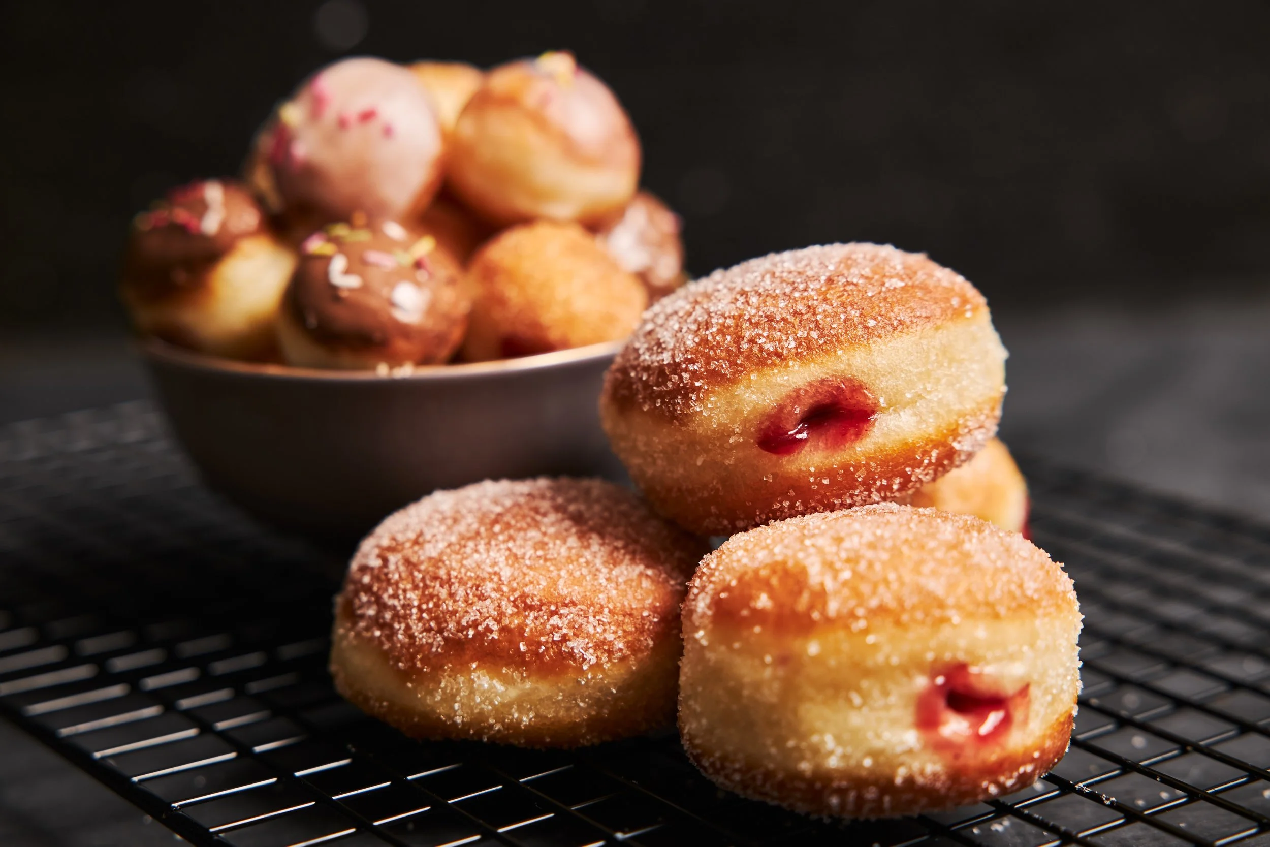 fried-donuts-with-sugar-cream-black-table.jpg