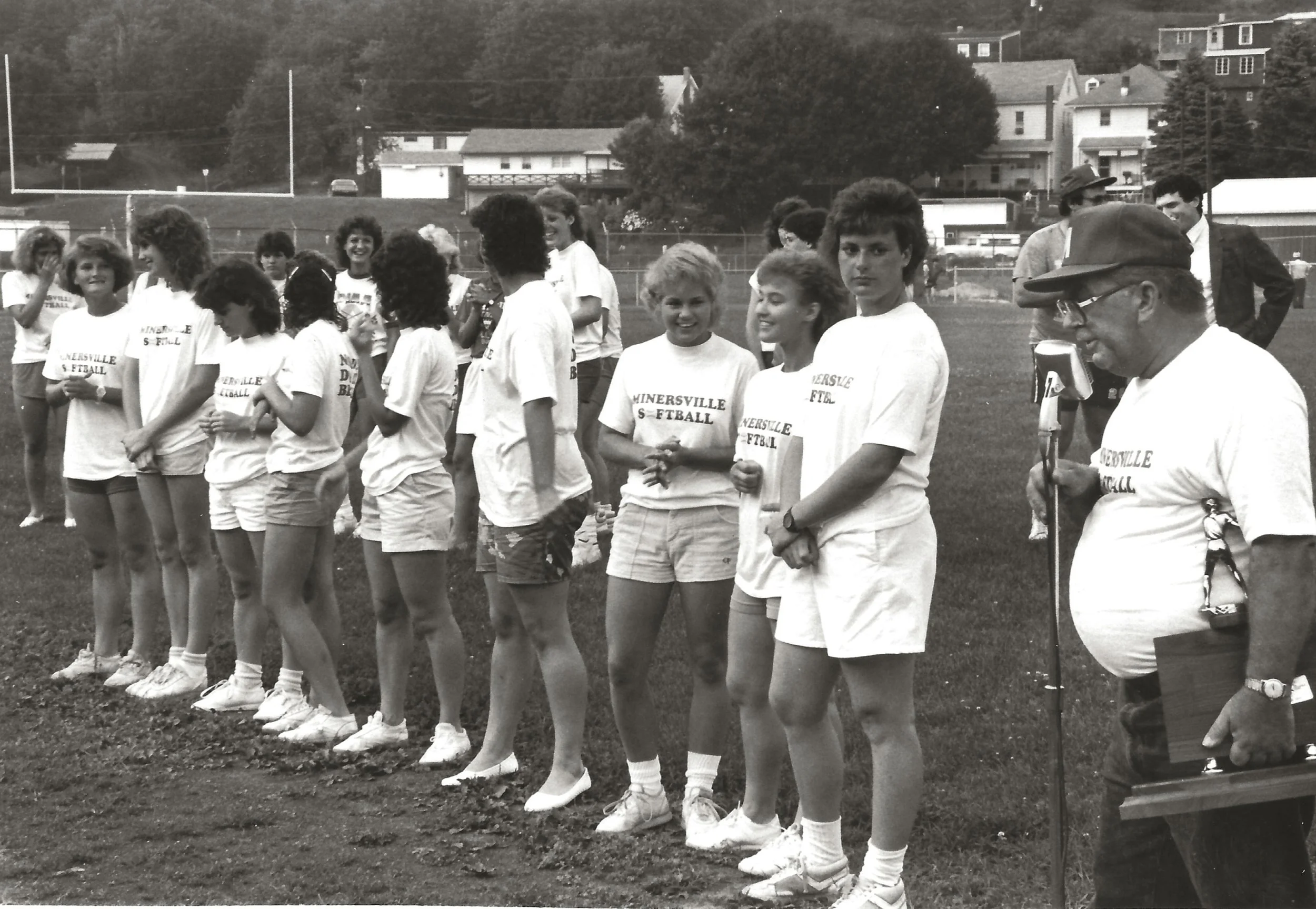 Coach Ken Schneck presenting his State Champion softball team to fans at Minersville High School stadium 06-16-86 (Matsko Photo)