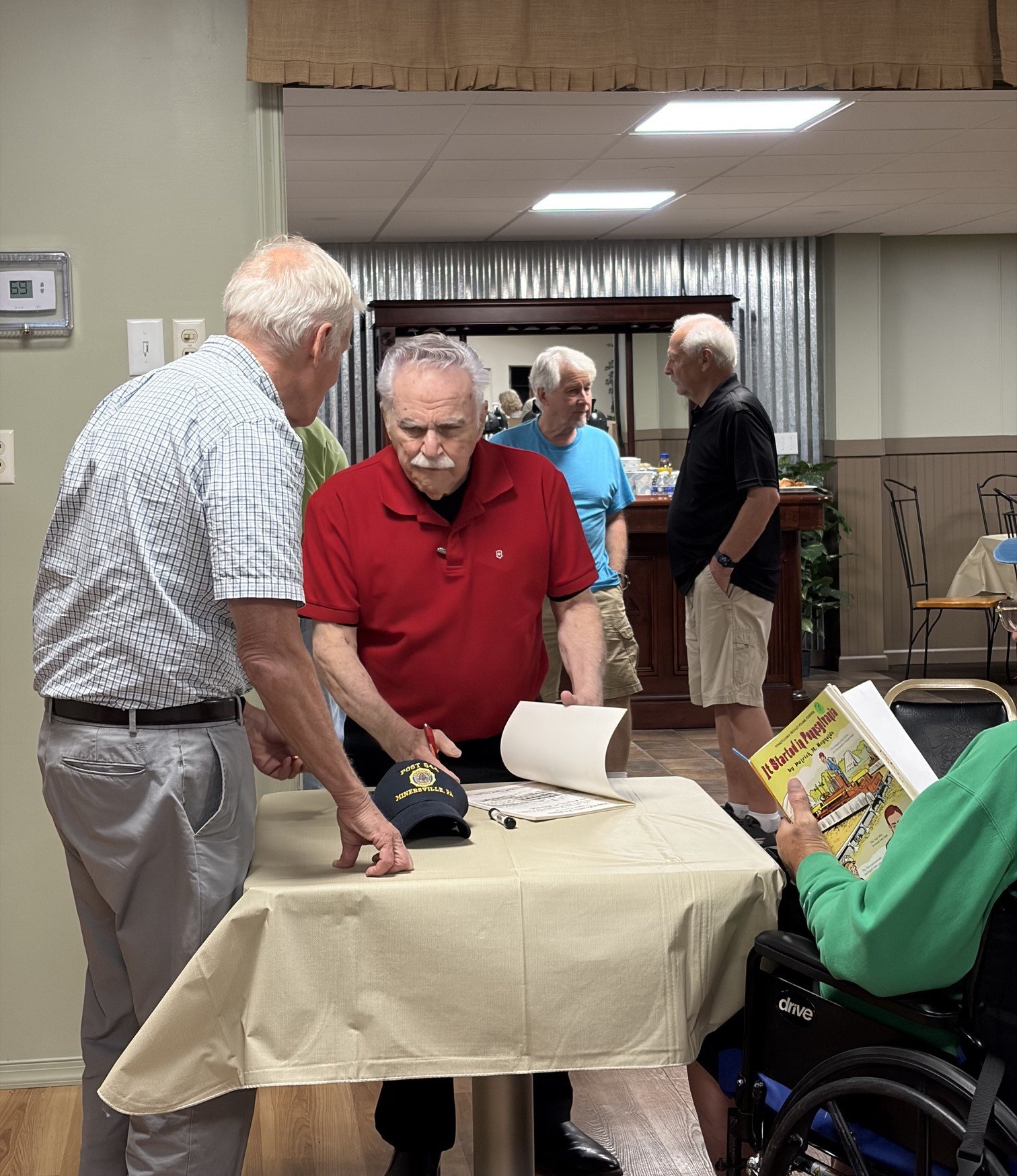 Patrick Reynolds signing his books