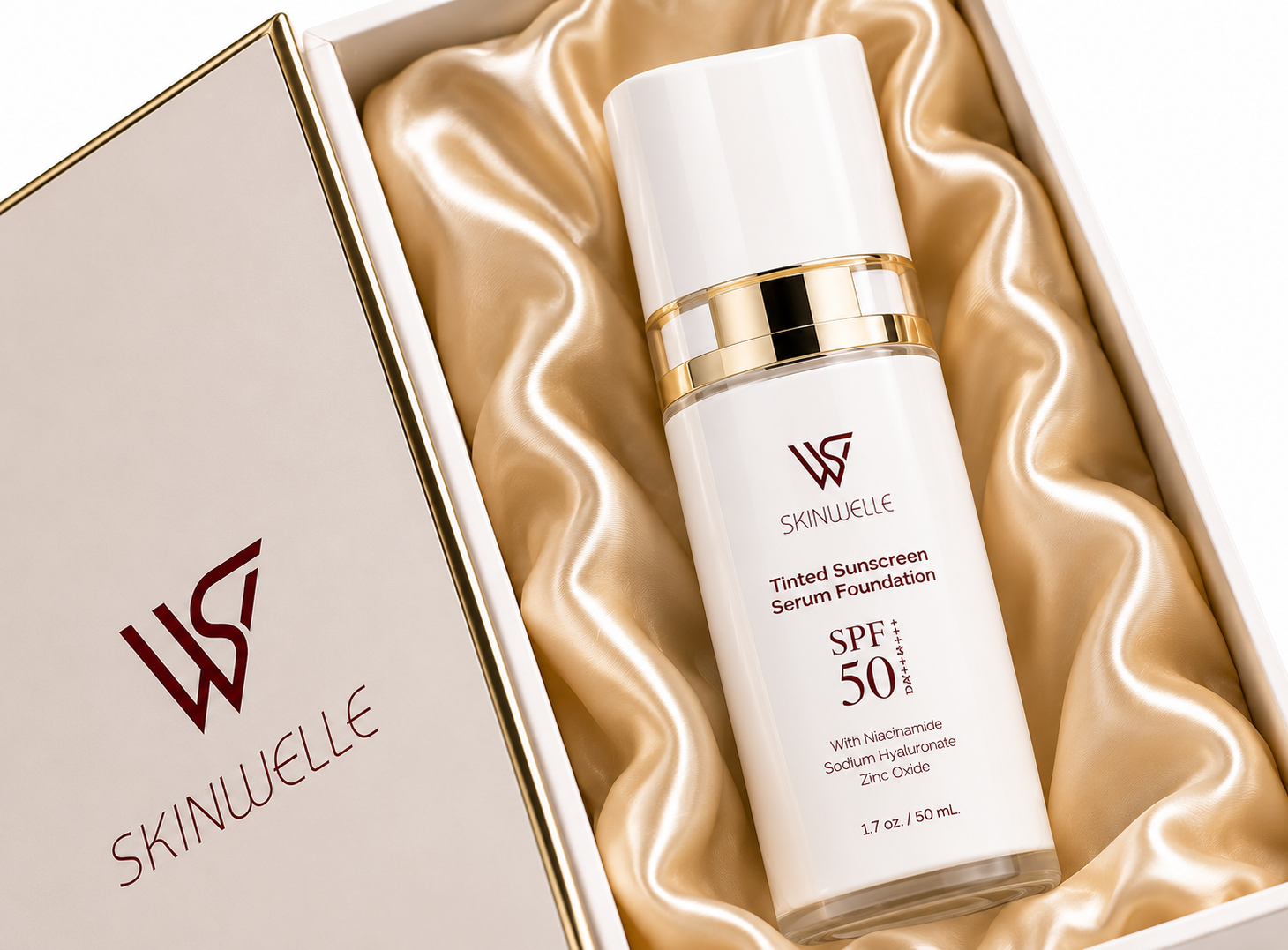 A white bottle of SKINWELLE tinted sunscreen serum foundation with SPF 50 inside a gift box lined with satin fabric.