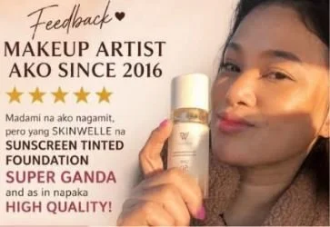 A young woman with makeup is holding a bottle of sunscreen foundation. The image promotes a makeup artist who has been active since 2016, highlighting that the sunscreen foundation is super good and high quality.