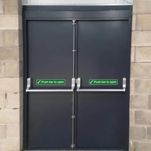 Double gray metal doors with push bars and signs that say 'Push bar to open'.