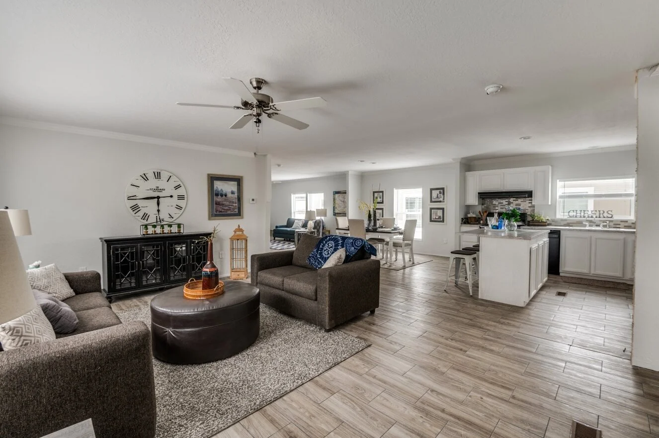 Spacious living room inside a manufactured home ready to decorate for Christmas.