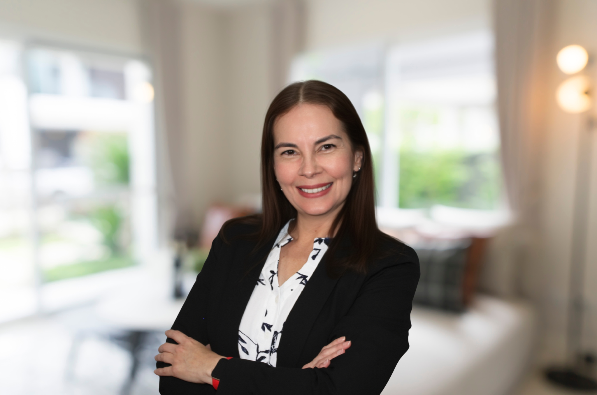 Viviana, friendly Fiesta Homes staff ready to help families buy and sell homes