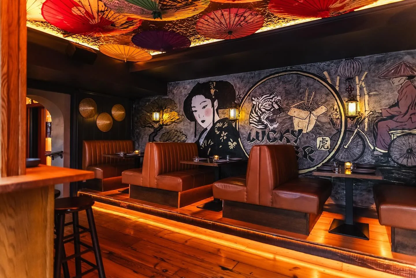 The Nightmarket &mdash; where you&rsquo;ll experience the hustle and bustle of Asian food markets in this cozy, yatai-inspired space at Lucky Tiger. Beneath a canopy of glowing parasols and bold street art, it&rsquo;s all warmth, color, and late-nigh