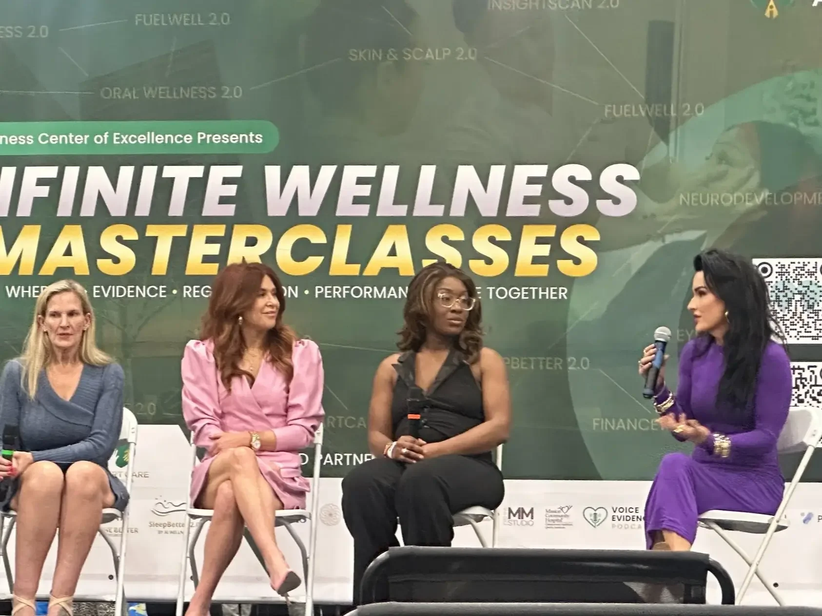 Lesley in a speaking conference with other speakers