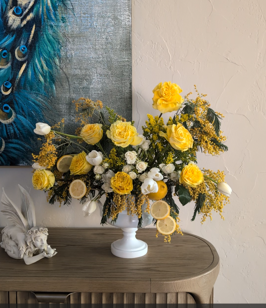 Yellow Mimosa, Garden Rose and White Tulip flower arrangement in white vase.