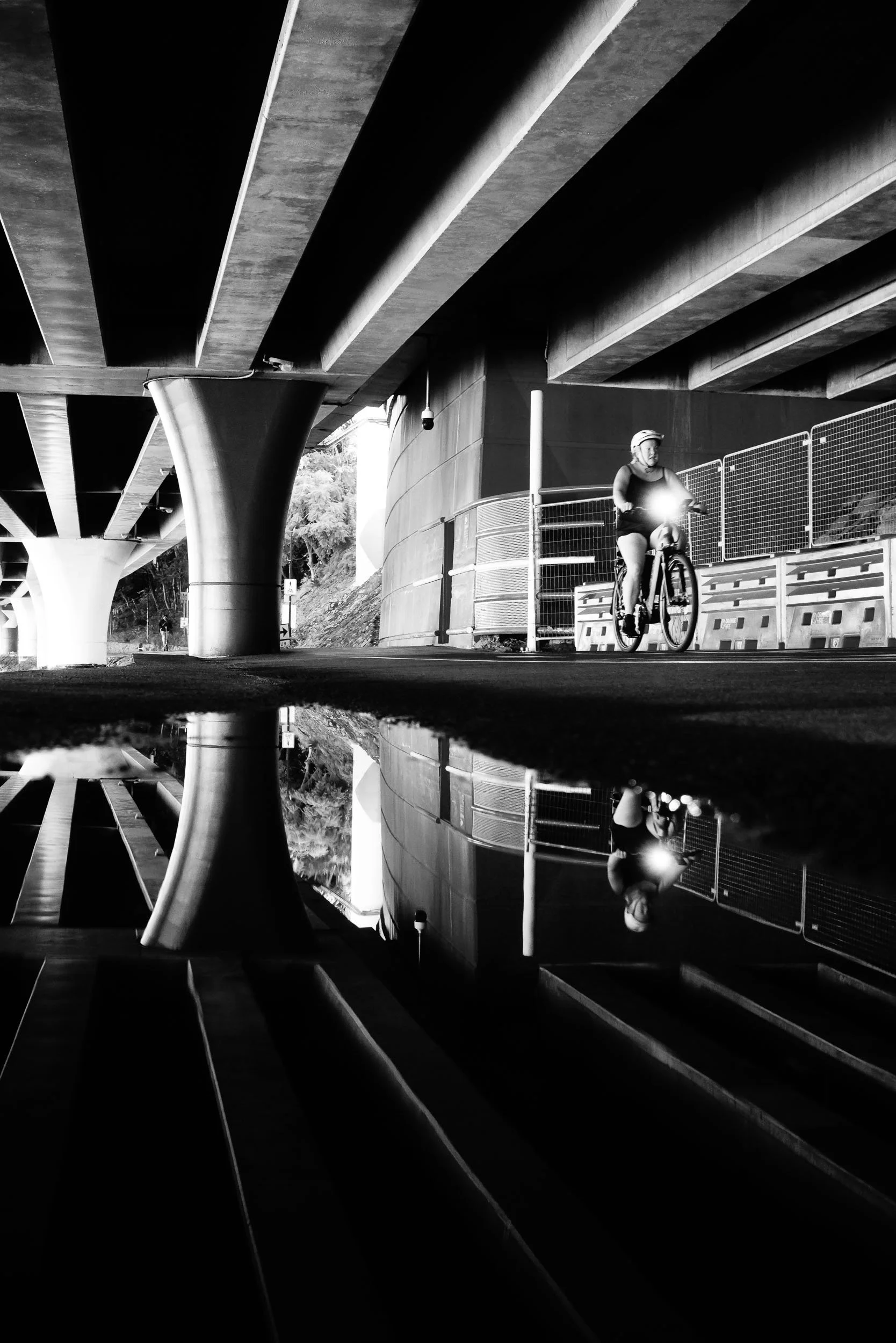 Dual Reflections: Beneath life's grand structures, the self profoundly reflects. It's a quiet visual journey, where inner calm elegantly mirrors outward motion, discovering peace in these parallel paths, moving forward in timeless harmony.