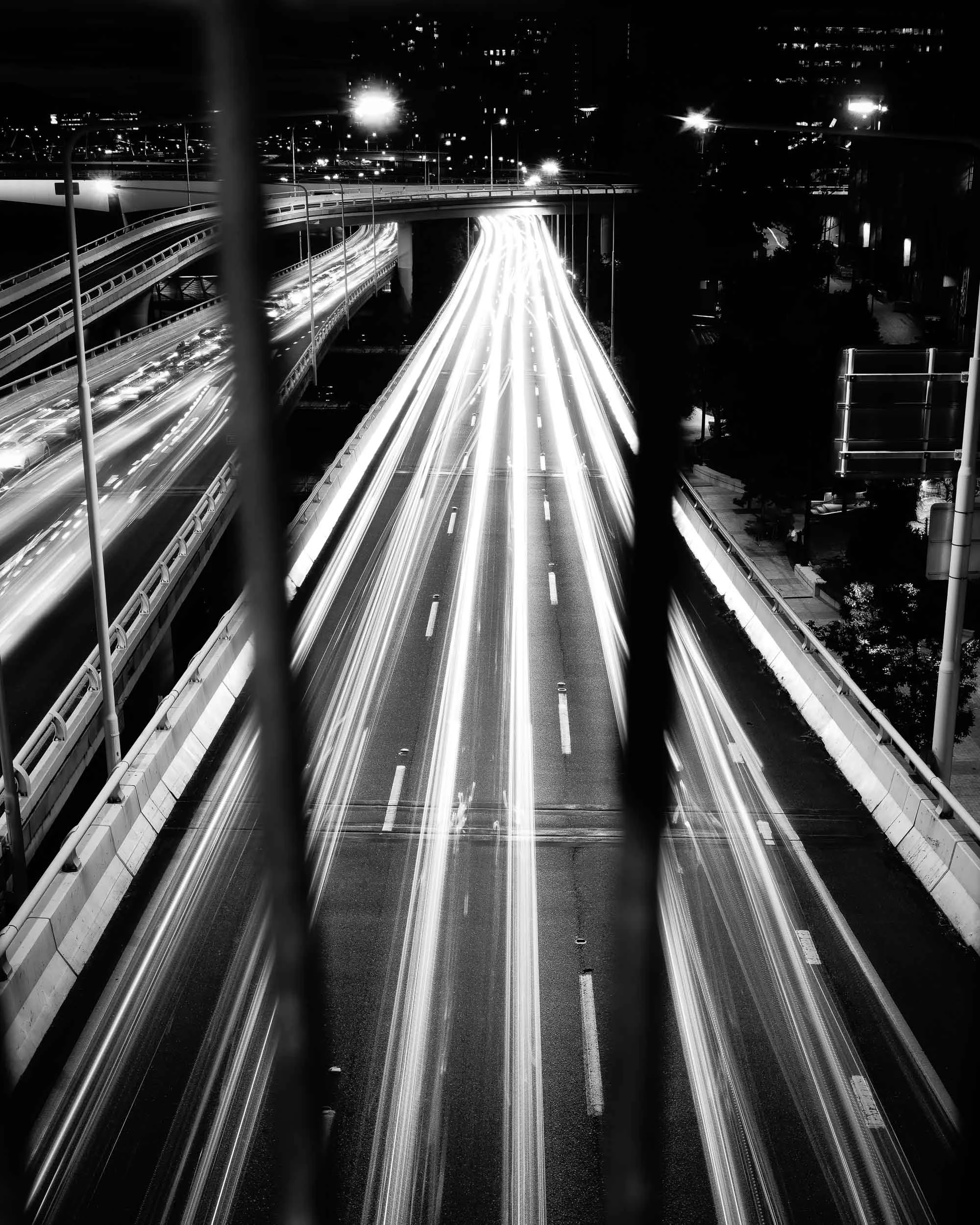 Life's Unseen Currents: Beneath the visible, life profoundly flows in vibrant, luminous blurs. This serves as a timeless reminder that unseen journeys perpetually move beneath our feet, gracefully guiding us through the night's quiet passage.