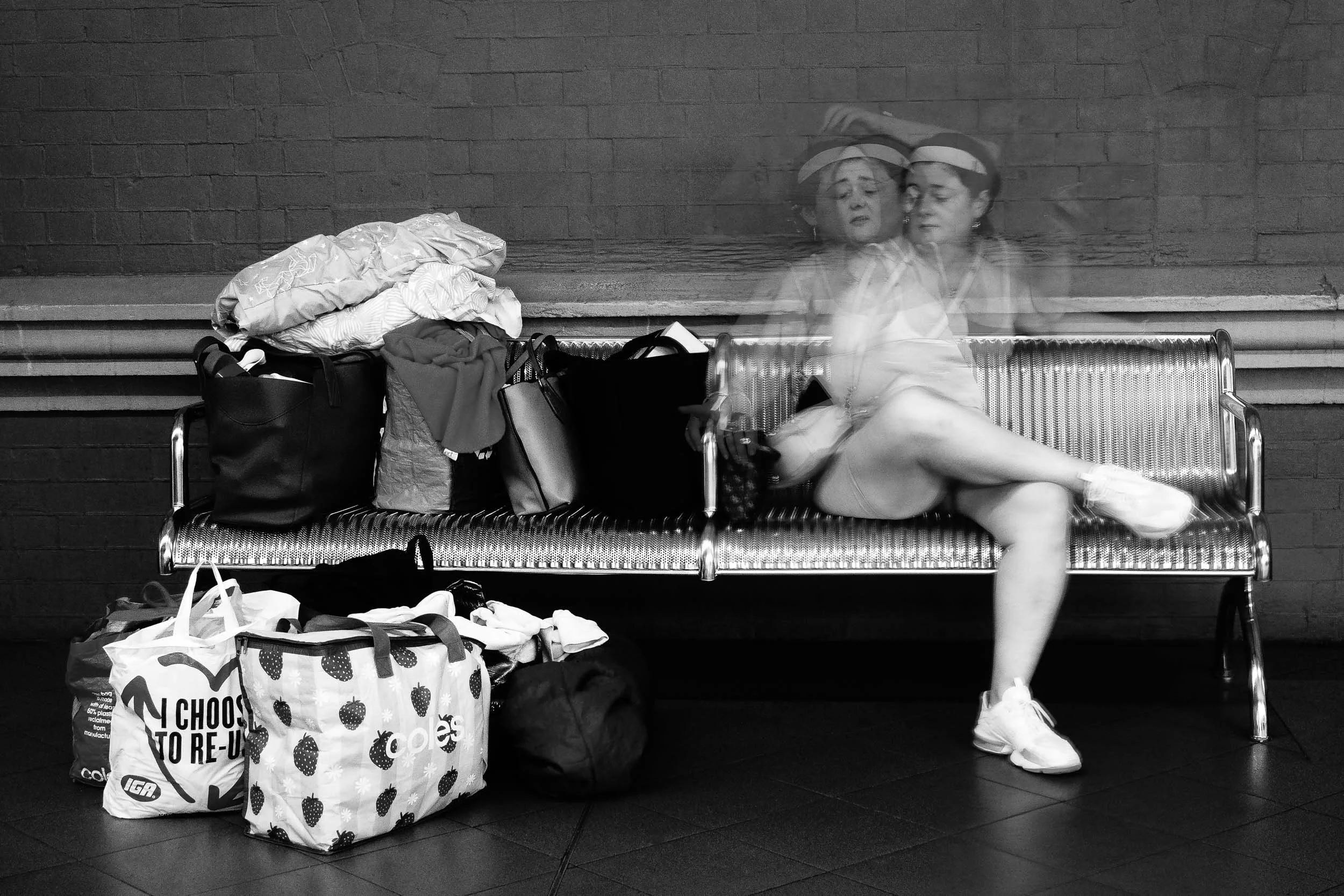 The Weight of Unseen Layers: Stacked grief, silent loss, a profound testament to resilience. Poised for her next destination, she embodies quiet strength, carrying burdens with grace, ever moving towards hope's distant light.