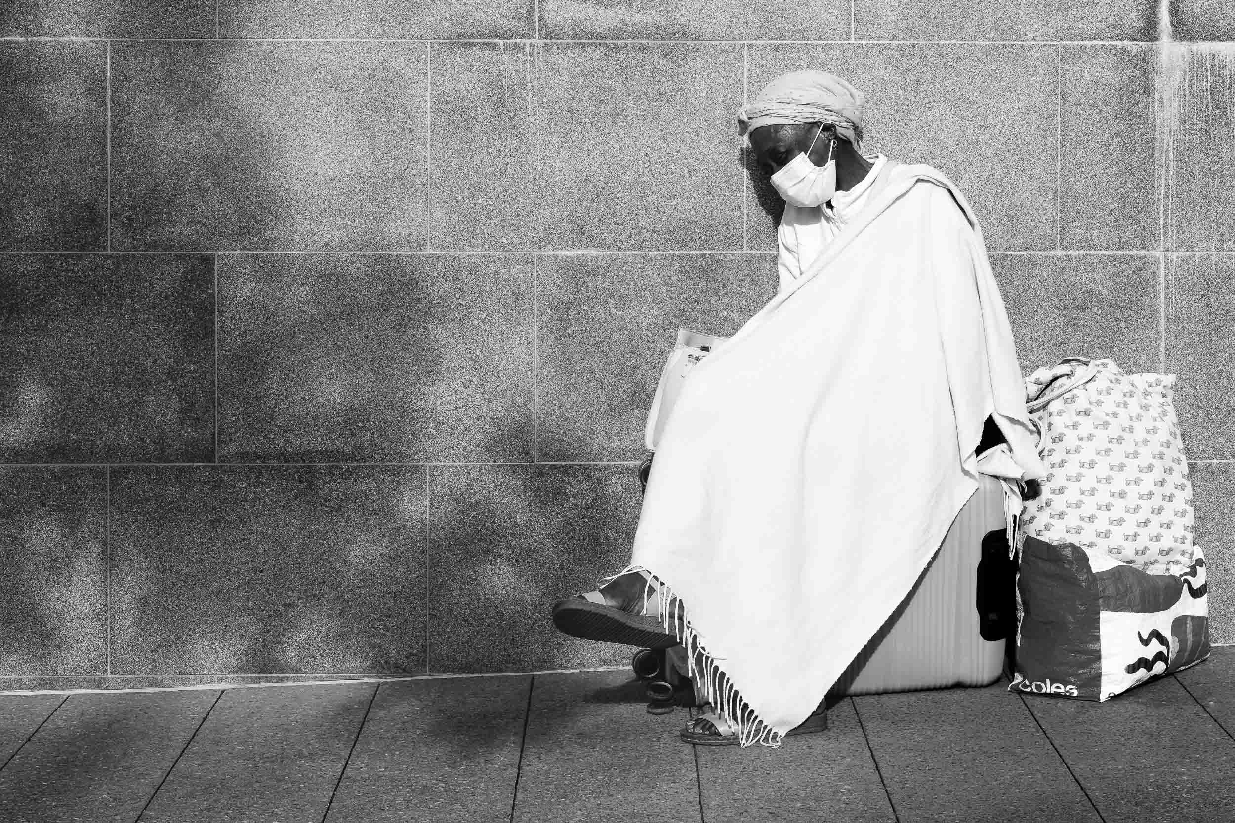 The Silent Embrace: Wrapped in anguish, a fragile shield. Your lens reveals this profound, unseen pain, held in quiet solitude, a poignant testament to silent struggle, eternally captured.