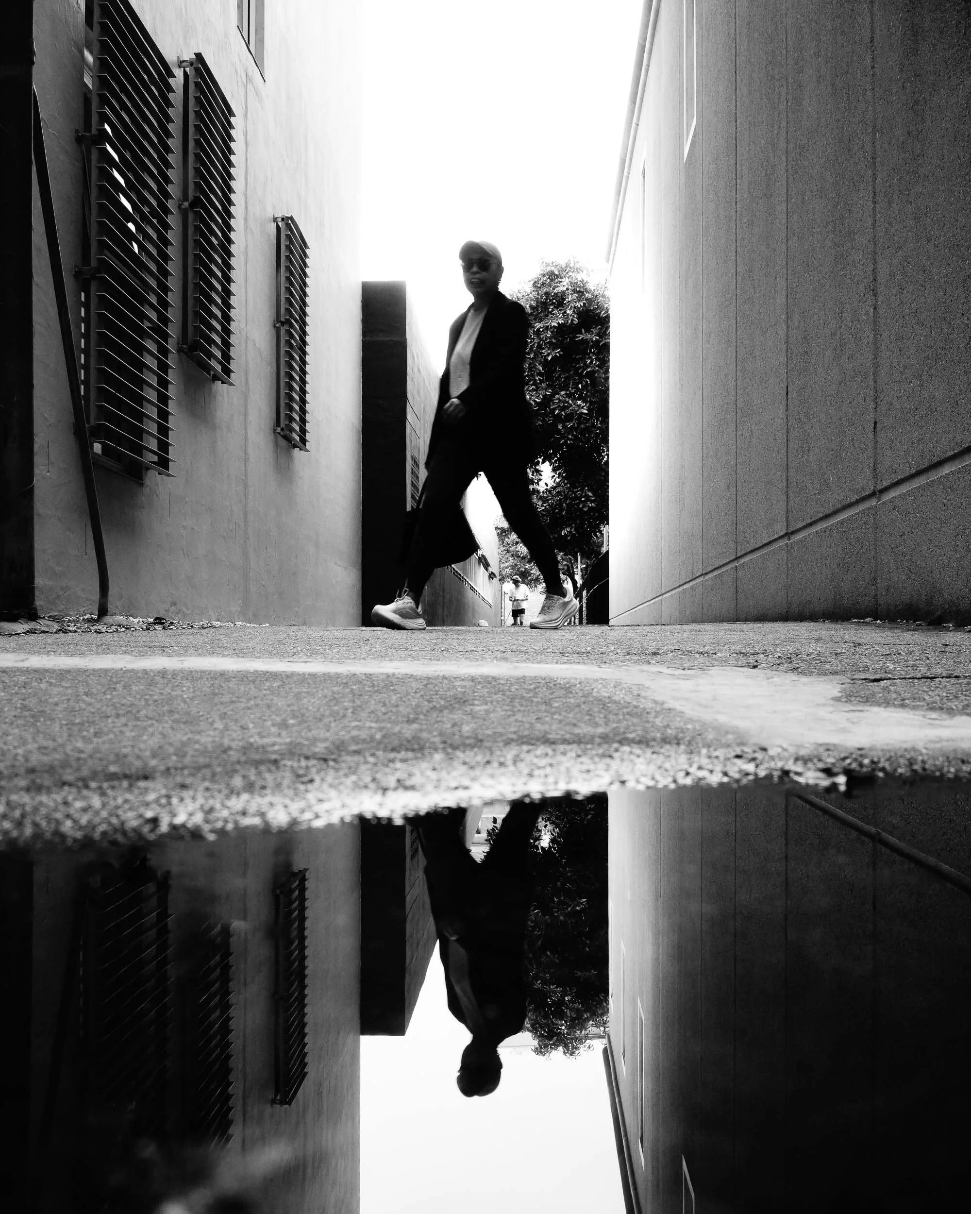 Between Worlds: Navigating life's compelling, narrow passages, a profound reflection unveils another self. Discovering presence within these ethereal in-between spaces, where inner worlds elegantly mirror outward journeys.