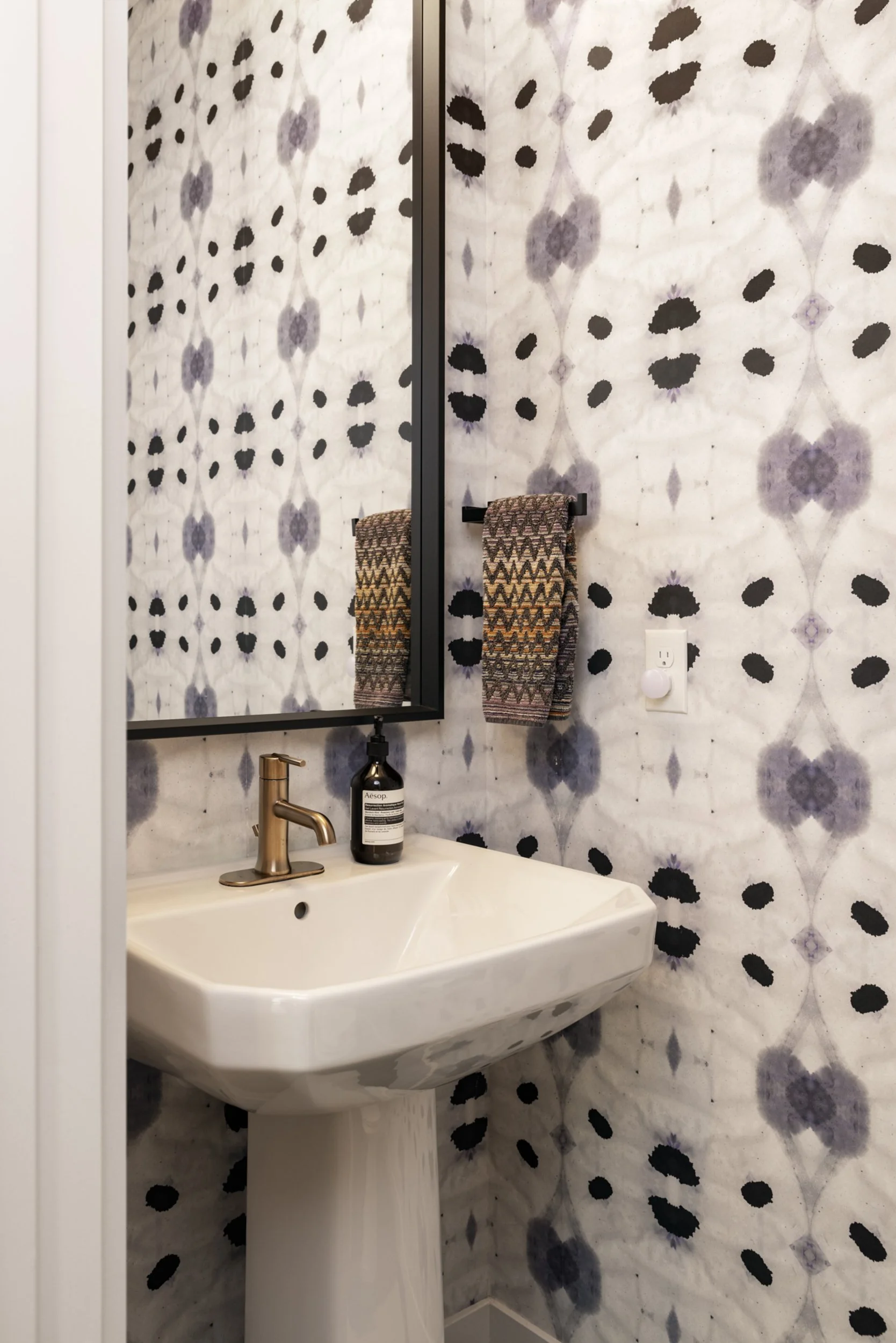 A powder room is a must for entertaining, and while there is no shortage of bathrooms at the Ruby, this one is our favorite. Featuring Eskayel wallpaper, these walls make selfies hard to resist. 