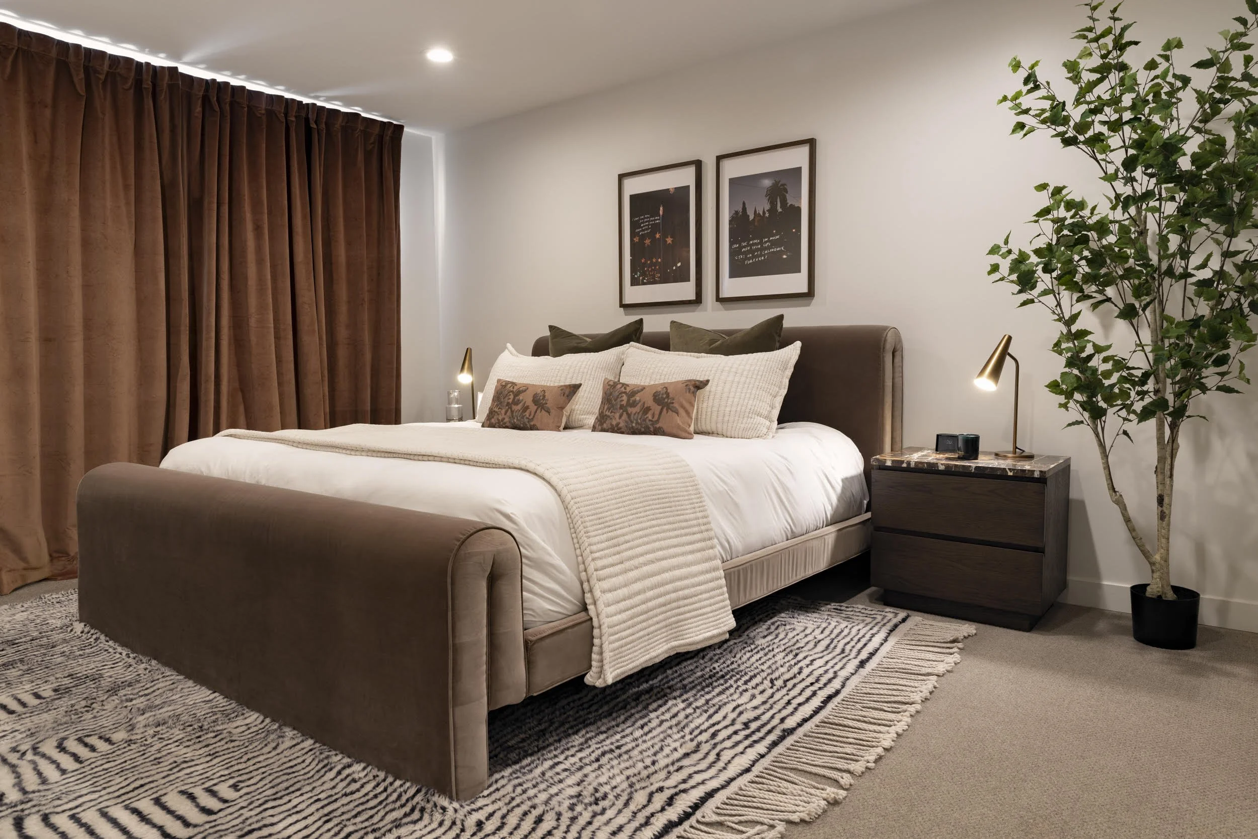 When the day is done, the primary suite is an ideal place to land. Featuring gothsloth's  'Moonlight in Mallorca' series, the mood is just right. Adjust the many pillows to your liking and lean into it. Each night stand offers a reading lamp and spac