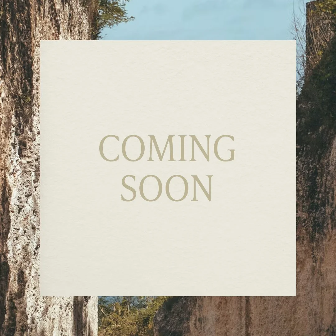 A scenic outdoor landscape with trees and rock formations, overlaid with a beige square containing the text 'COMING SOON'.