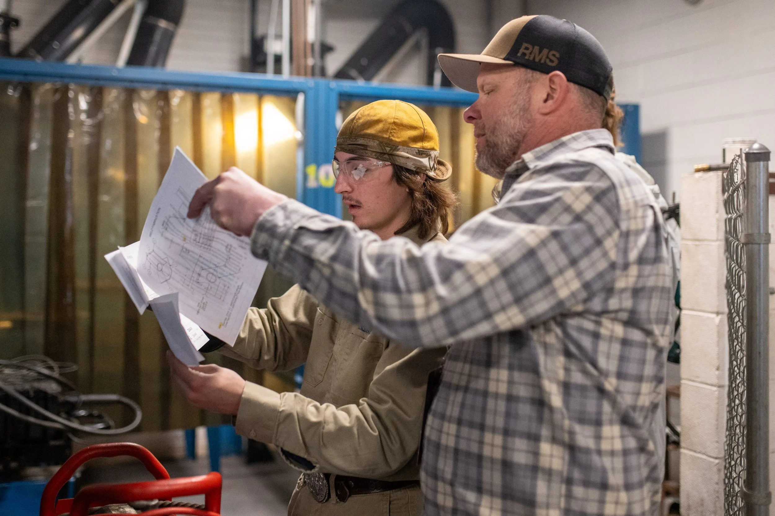 A SkillsUSA member wearing scrubs poses for a photo after her competition.