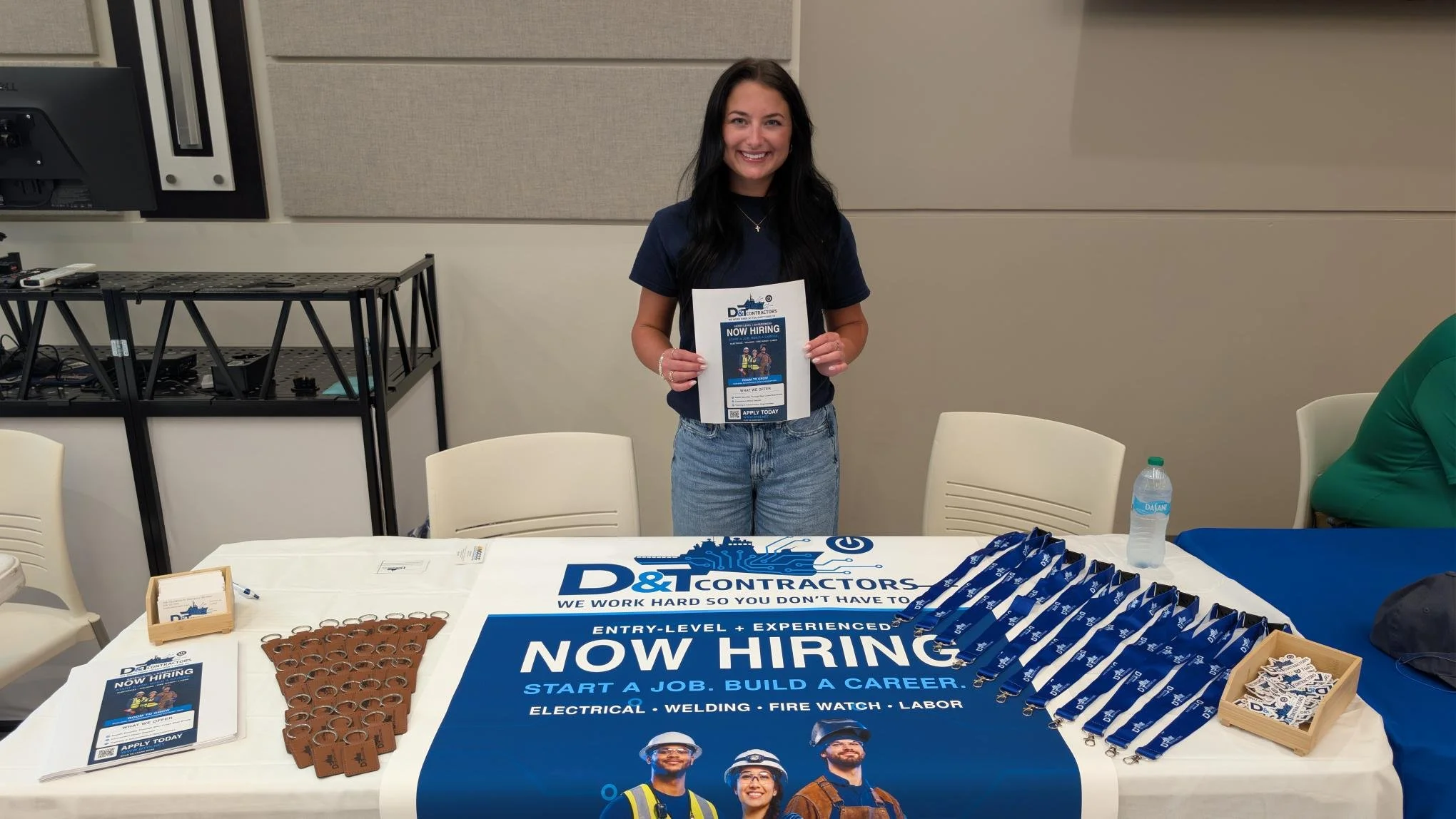 D&T Contractors recruiting table at an MGCCC job fair with Now Hiring banner