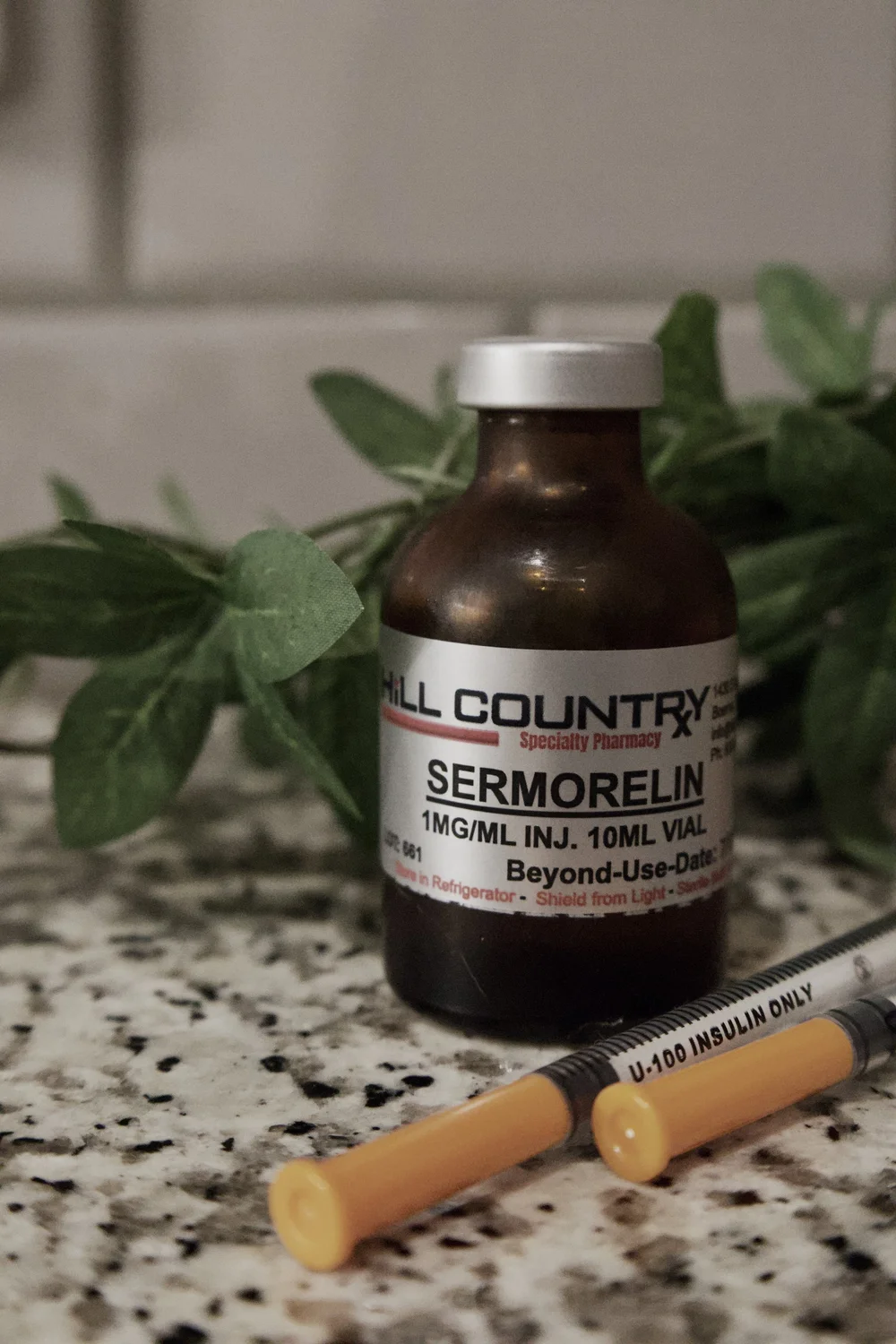 Sermorelin vial with insulin syringe