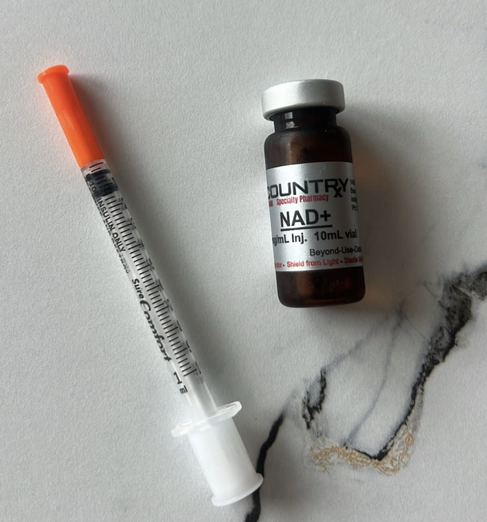 NAD+ syringe and bottle