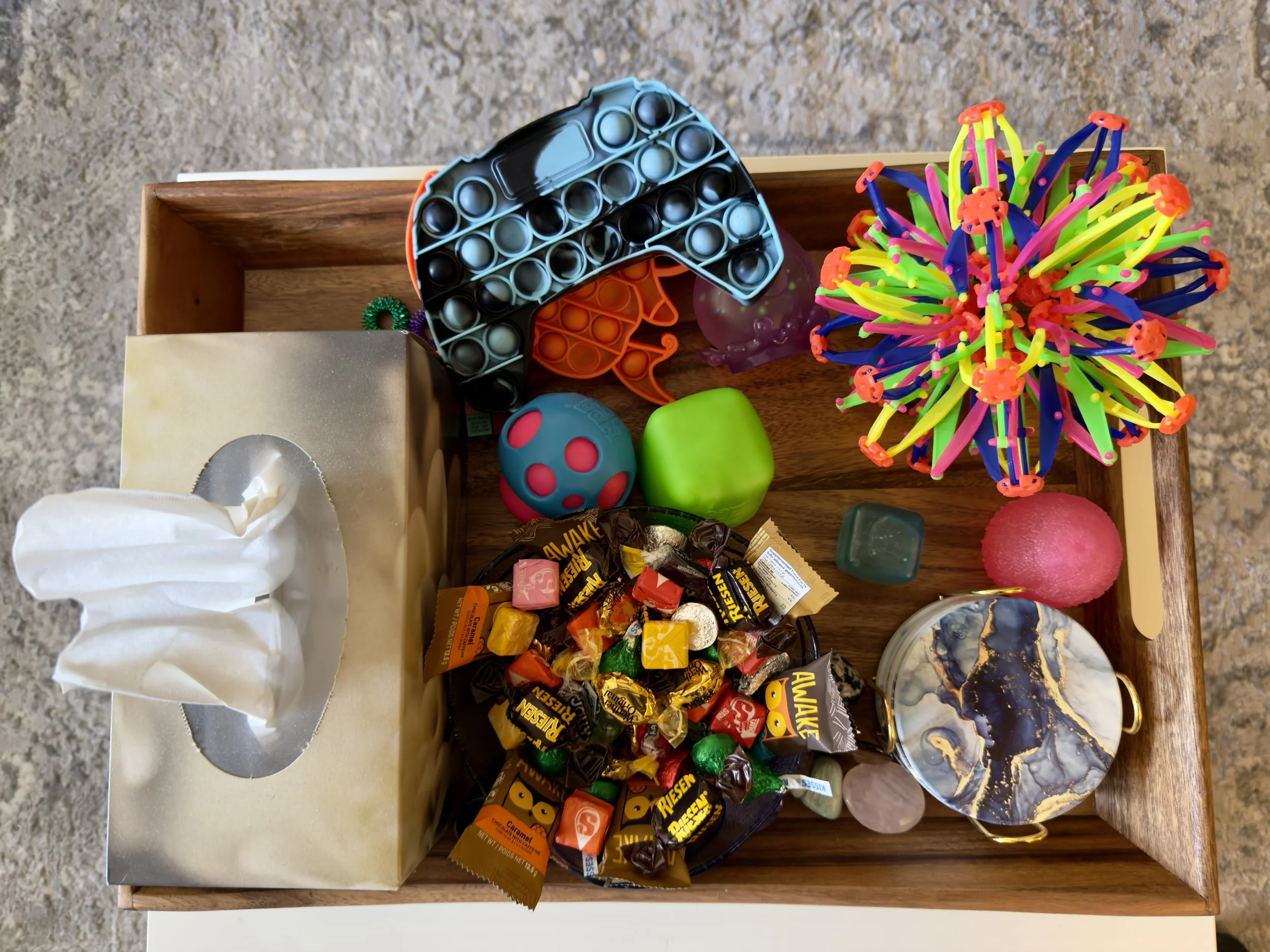 Fidget toys, candy, tissues included.